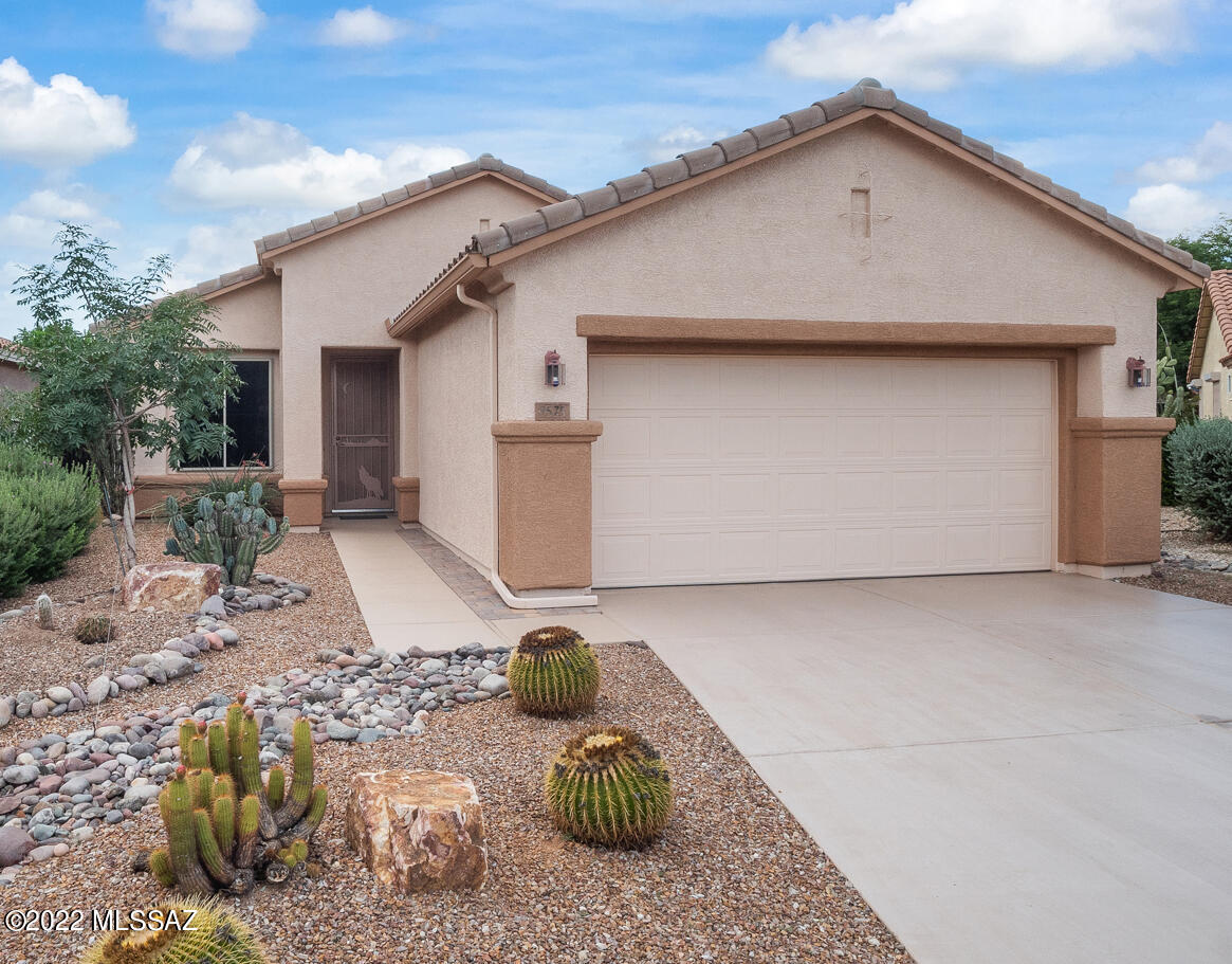 Nestled in the North Tucson Mountains Foothills, this Sunrise model with 1BDRM/Den (could be second Bdrm) and 2 Baths hosts an updated HVAC system (Oct 2019) and new roof underlayment in Feb 2022. Enter through the front portico and into the spacious Great Room with decorative Electric FP. The inviting Breakfast Nook and galley Kitchen with pantry are sure to please. The Den gives you that extra space for an office or a second Bdrm. The Primary Bdrm has a large walk-in closet, bay window and en suite with spacious shower. The back patio and well-landscaped back yard will give you hours of enjoyment in the delightful Tucson evenings. And you get all the amenities the Premier 55+ Community of Sunflower has to offer!