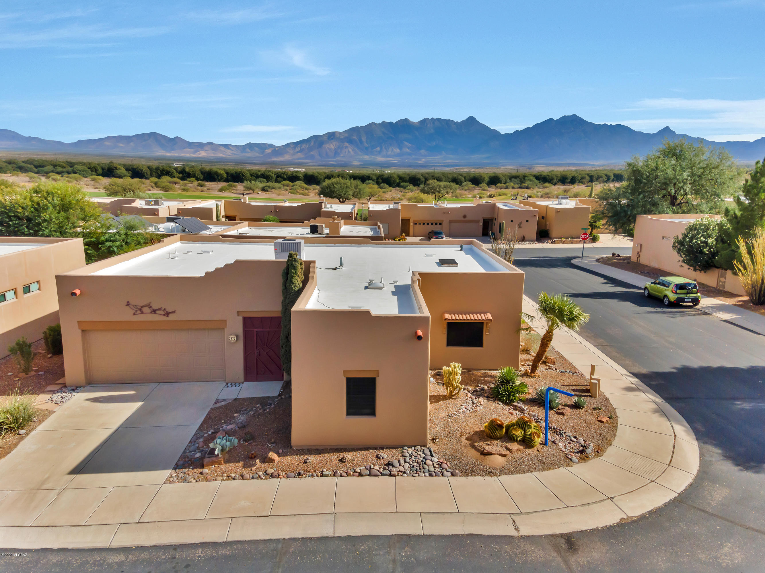Enjoy conversation & make memories with family & friends in your backyard that offers a picturesque mountain view. This spacious home has everything you need. 2 bedrooms 2 baths, a den & an extra room is true luxury. One can have a home office or gym, a recreation, a media room, mini bar, the list is endless.High ceilings. Large kitchen island. Well maintained beautiful home. Exterior was painted Oct 2020. Roof re coated 2018.Water heater is about 2 years old. Irrigation 2018. Located In the Desirable Gated Community of The Springs where you can be actively be involved in outdoor activities or enjoy picnics w/ neighbors in the park.Minutes away from Torres Blancas Golf Course nestled in the Santa Cruz Valley at the foot of Santa Rita Mountains. Superb amenities are available in the Santa Rita Springs Center. It's Green Valley Rec's largest social location.It has a swimming pool,hot tub,fitness center,computer lab,clay studio,camera club,the Art League & more. Make this yours today!
