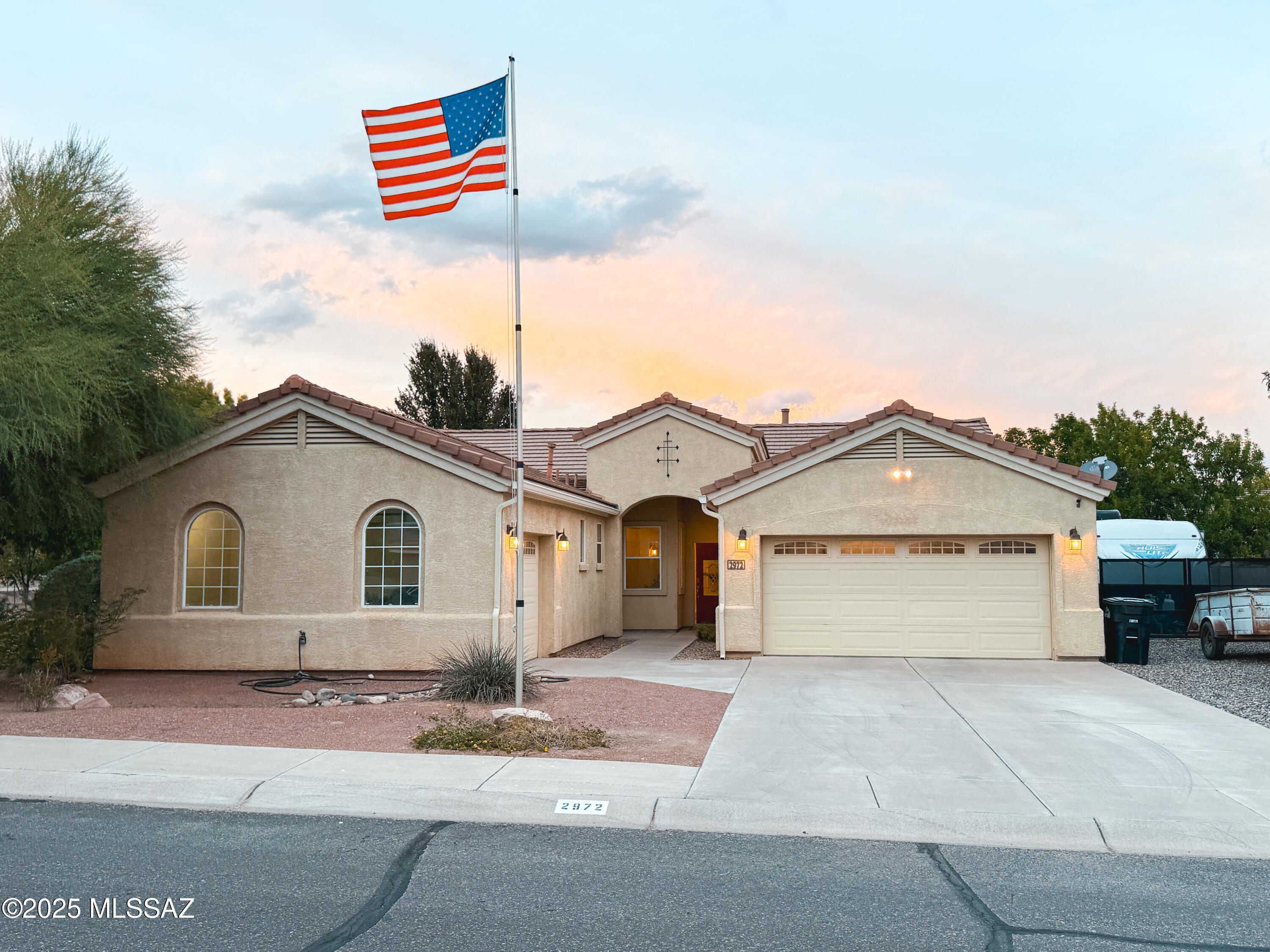 Welcome to this beautifully maintained 4-bedroom, 2.5-bathroom home, offering comfort, space, and stunning outdoor living in one of Thatcher's most desirable neighborhoods. From the moment you arrive, you'll appreciate the inviting curb appeal and the thoughtful design that makes this house feel like home.

Open-concept kitchen with granite countertops, stainless steel appliances, a center island with bar seating, and warm wood cabinetry—perfect for cooking and entertaining.
Spacious living room featuring plush carpeting, abundant natural light, and a cozy stone fireplace as the focal point.
Primary suite includes a private en-suite bath and walk-in closet, with three additional bedrooms offering comfort and flexibility.
 Large dining area ideal for gatherings, with elegant lighting and views of the backyard.

Outdoor Living at Its Best that also includes irrigation rights.

 Beautifully landscaped backyard with lush green grass, mature shade trees, and plenty of room to play or relax.
 Covered patio and extended concrete seating areaideal for outdoor entertaining.
 A charming pergola dining space, perfect for alfresco meals or evening hangouts.
 Storage shed and gated side area with extra space for pets, hobbies, or a garden.

Set in a quiet neighborhood with a friendly community feel, this home offers room to grow, relax, and make memories. Whether you're hosting in the backyard, enjoying a cozy night by the fire, or cooking a family meal in the heart of the home, this Thatcher property is truly special.