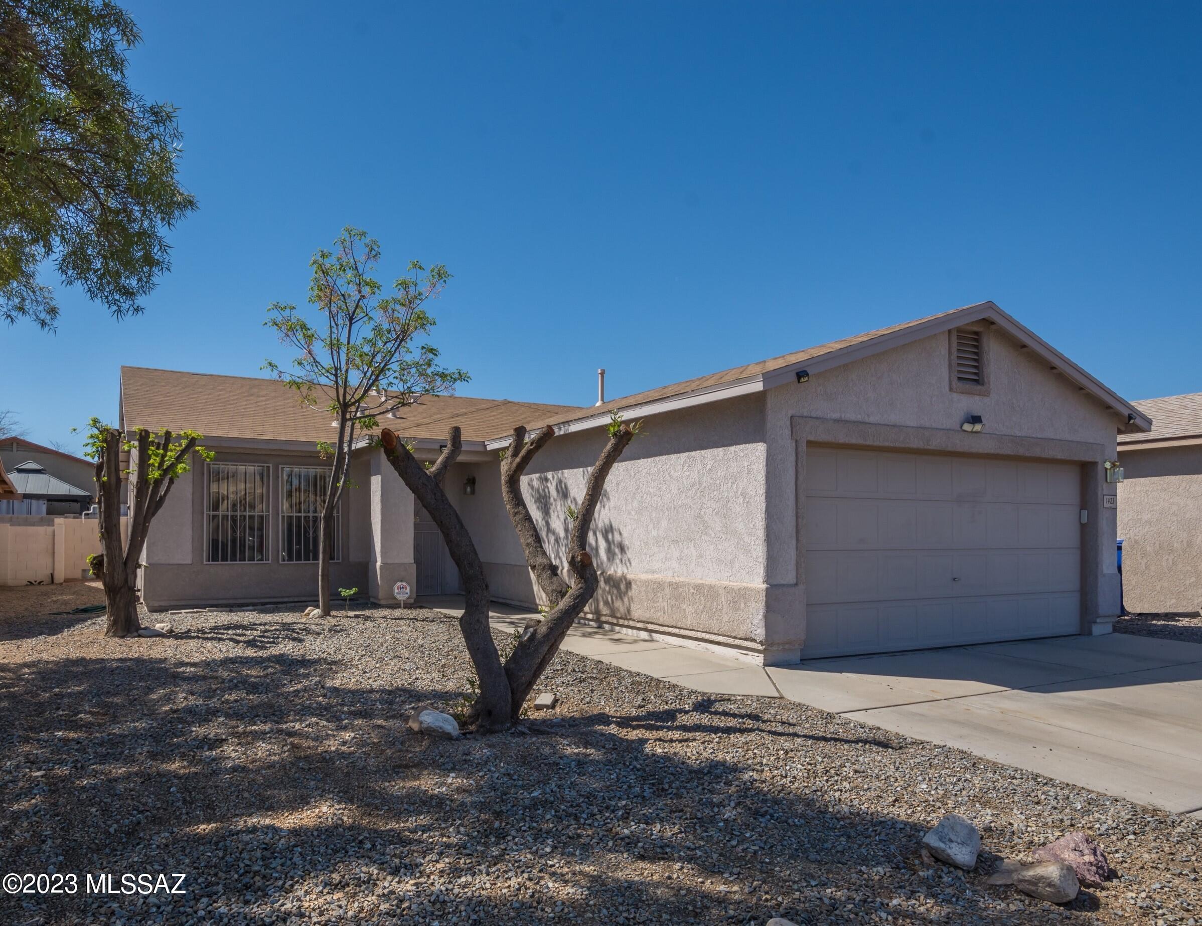 This charming 3-bedroom, 2-bathroom home features beautiful large format tile throughout, spacious eat-in kitchen with plenty of room to cook and dine.  Large pavered backyard perfect for entertaining or relaxing. Location reigns supreme, enjoy the perks of being on a cul-de-sac street while having easy access to I-19, you'll be just minutes away from great shopping, dining, and entertainment options. Fantastic storage plus an extra shed in back. Don't miss your chance to make this your new home sweet home!