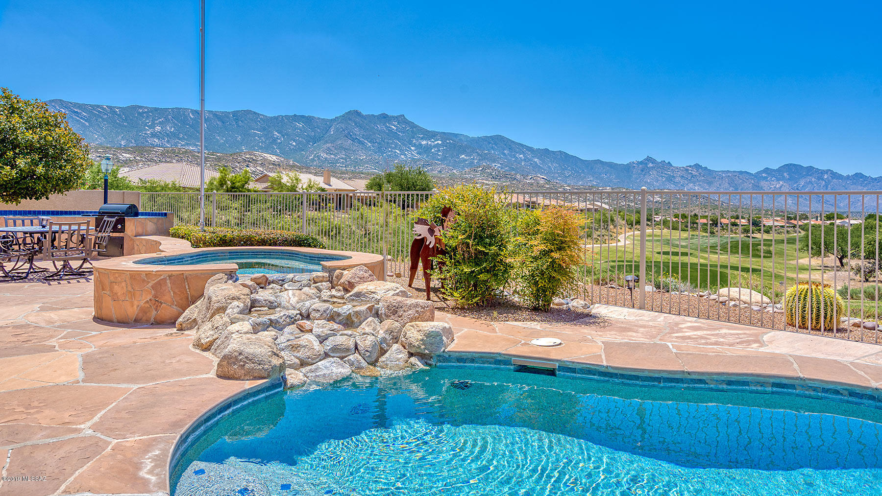 Amazing Views looking down the golf course with the Catalina Mountains in the background. Enjoy Mountain and Sunset Views from your covered patio, pool & spa. This Galleria model with upstairs guest accommodations features 3 bedrooms, den, hobby room, and 2 and a half baths. Great for entertaining!