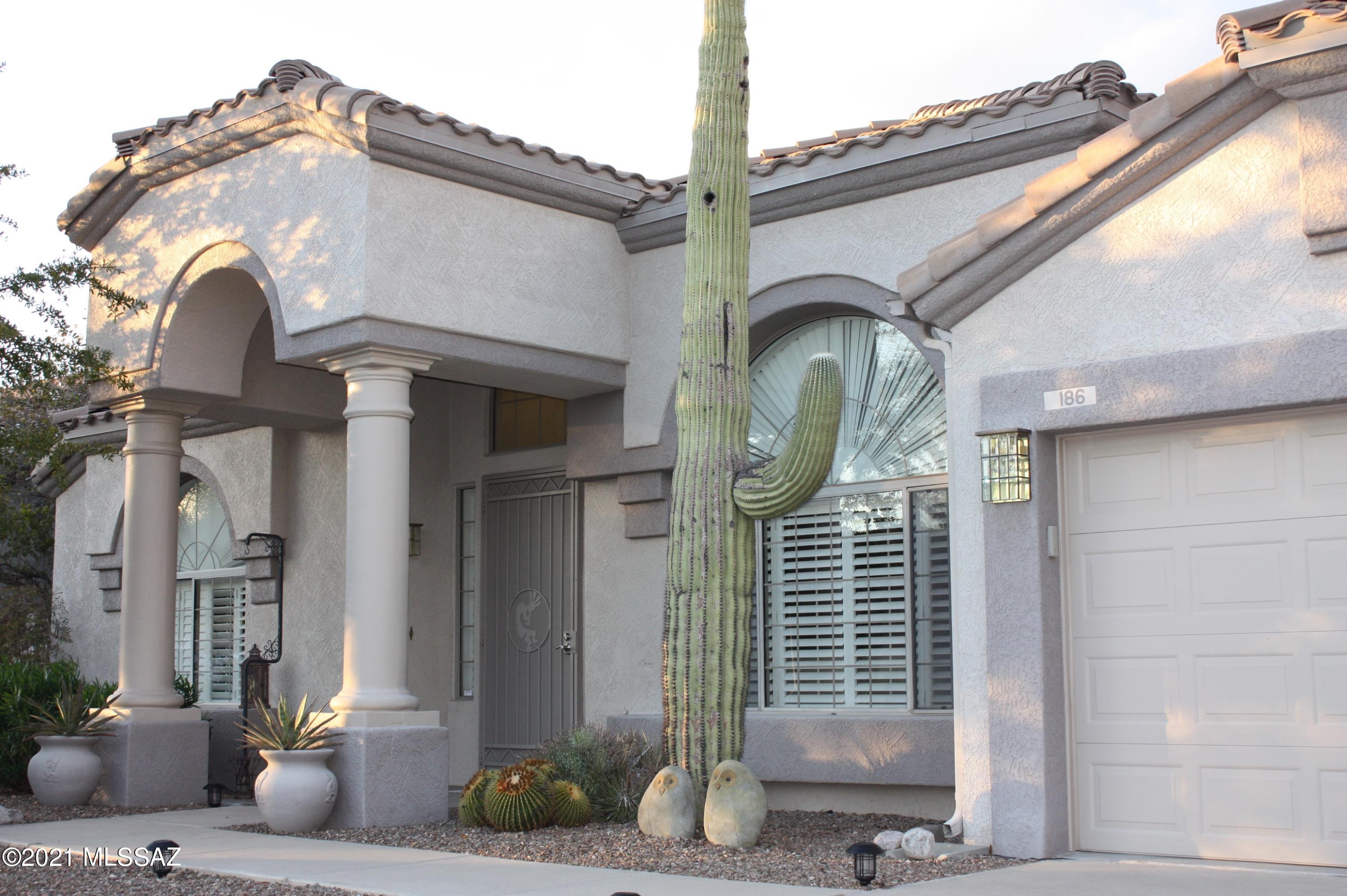 This highly sought after single story floorpan impresses most with its huge vaulted ceilings and dramatic arches. Includes three large bedrooms, plus an office and two and a half baths. Office features built in custom cabinets off the front door. Large living space with dining area. Additional open living space and kitchen with views to the pool and outdoor oasis. Soft color tones throughout. Beautiful built in nooks with dedicated lights to display your collections. Enormous covered patio and BBQ built in area to enjoy all summer long. With natural desert behind you, you really can enjoy this space privately. The master features  towering ceilings and a brand new bathroom with separate soaking tub and larger walk in shower.
