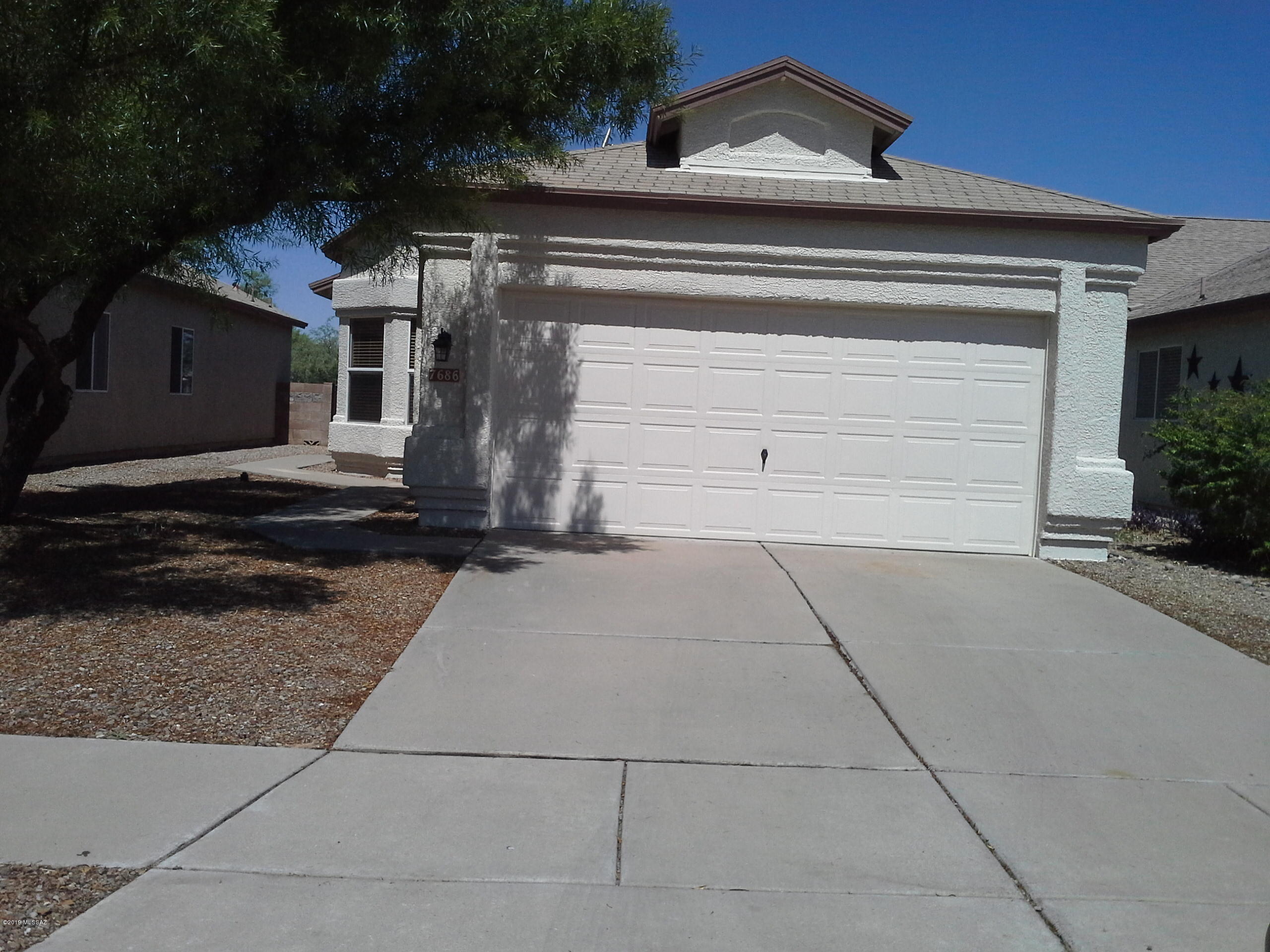 Great location in Rita Ranch.  Unique Split floor plan with centrally located laundry room.  Easy access to I-10, Davis Monthan AFB, UofA tech Park, Raytheon & Amazon.  Nice back Yard for entertaining or maybe add a pool.  Beautiful kitchen with all stainless steel appliances & large living area.  Tile throughout, very well maintained.  Move in ready.  All appliances stay.  Don't let this one get away.   New Hot water heater just installed.