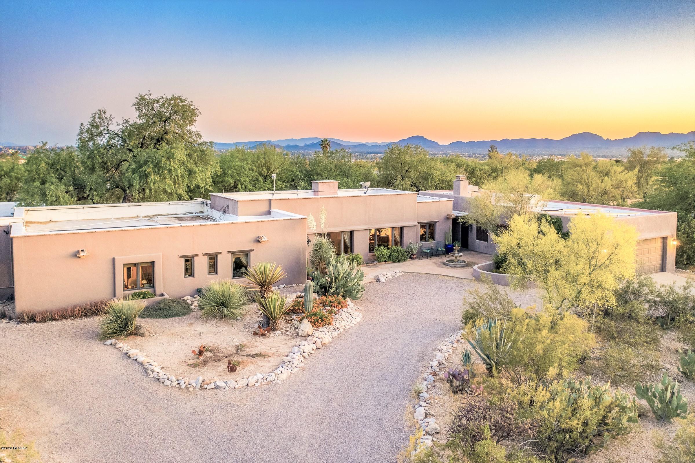 This beautiful Catalina Foothills Estate is an original ''Old Foothills'' gem designed by award-winning, Joesler-trained, architect Gordon Maas Luepke. Panoramic mountain views, pristine plank wood ceilings, pigmented concrete floors & original tile details create a harmonious blend of classic southwestern styles.  Gorgeous, refinished salt-water pool, master suite with private sunset garden, XL garage/workshop and solar power create the perfect Sonoran Desert indoor/outdoor living. Attractive 495sf building w/ fantastic potential for a stylish guest or pool house (plans included). Enjoy the peace & beauty of the desert within the privacy & history of a grand old estate. Quiet, friendly neighborhood. Walk/bike to Tucson's best shopping, restaurants & Loop path. Close to UA & downtown.