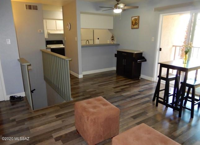 UPDATED AND READY TO MOVE IN LAS COLINAS CONDOS.NEW ENERGY EFFICIENT SLIDING GLASS DOORS TO ALLOW NATURAL LIGHT, UPSTAIRS AND DOWNSTAIRS.NICE GRAY WOOD LAMINATE FLOORING IN FAMILY RM.BOTH BATHROOMS REMODELED,EXTRA LARGE MASTER BEDROOM DOWNSTAIRS  OPENS TO COVERED ENCLOSED PORCH.SPACIOUS WALK IN CLOSET. KITCHEN AND FAMILY ROOM PLUS POWDER ROOM ON TOP LEVEL WITH BALCONY OVERLOOKING POOL. ONSITE LAUNDRY FACILITIES,NICE MATURE VEGETATION.COVERED CARPORT AT BACK DOOR.HOA FEES COVER..WATER,SEWER,EXTERIOR CARE,TRASH,ROAD MAINTENANCE,ROOF,COMMON AREAS,COMMUNITY REC ROOM,LAUNDRY FACILITIES,2 POOLS,HOTWATER HEATER,AND ON SITE MAINTENANCE AND PROACTIVE HOA.NO RENTALS ALLOWED.COMES COMPLETELY FURNISHED.