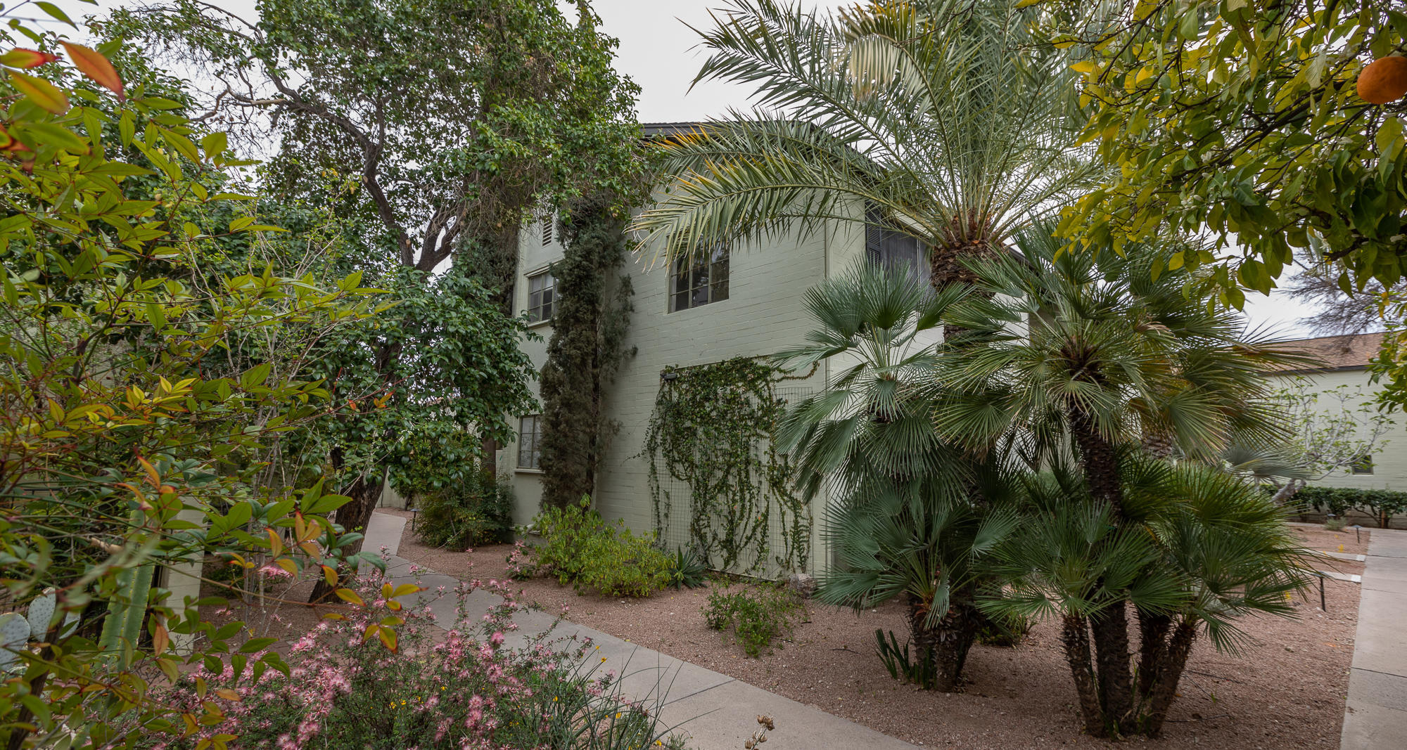 Charming 2 story, 3br/3ba, Sam Hughes living in historic El Encanto Condominiums. Very large rooms with french doors leading to covered patios and verandas. Well maintained grounds with lush mature landscaping. 2nd floor master/br has walk-in closet and veranda thru french doors. Downstairs den could be 4th br. Close to UofA, restaurants, shopping and bus routes. One of only 3, 2 story larger units in El Encanto.