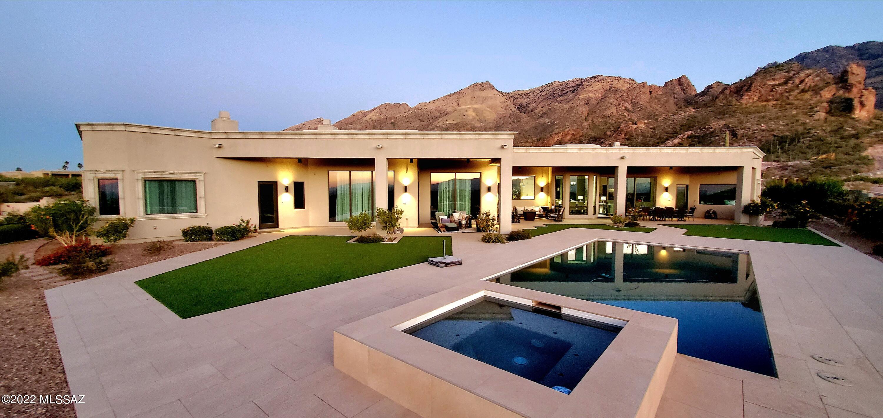 Incredible new masterpiece by Albert Moussa in  prestigious guard gated Finisterra.  6,000 sq ft of pure beauty.  Spectacular views in every direction.  Enjoy one of the most peaceful, private settings in the Catalina foothills overlooking the city lights, mountains, sunrises and sunsets. Wonderful yard to watch the fireworks all over the valley. Just minutes away from Ventana Canyon Golf Course and Resort. Every room in the house is beautifully designed by renowned artist Quetzally Hernandez Coronado. 2 of the 6 ensuite bedrooms are used as an artist studio and an office. Control your entire smart home from your phone - thermostat, water heater, watering, refrigerator alarm.  Master builder Albert Moussa's newest homes are selling for 5 to 8 million dollars just a few hundred yards away
