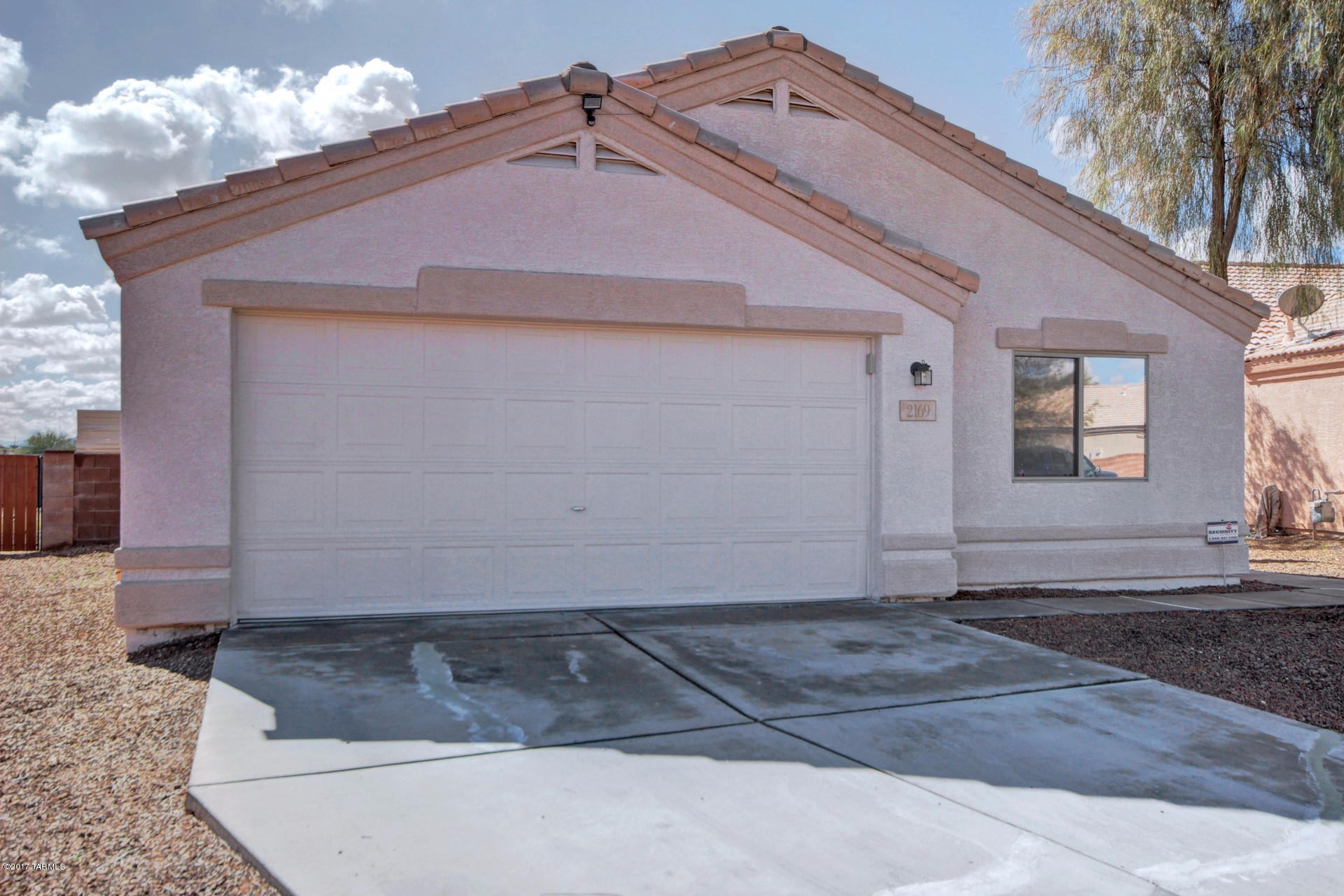 Your search is over! Fantastic Tucson home with a wonderful open floor plan, vaulted ceilings and neutral color palette throughout! Whip up a culinary treat in the eat in kitchen with custom cabinetry, ample counter space, pantry and a raised breakfast bar. Spacious master bedroom has beautiful laminate flooring, walk in closet and an adjoining bath with dual sink vanity. Huge backyard is complete with a covered patio, grassy area and low care desert landscape! This home is ready for your personal touches! See it today and start packing!