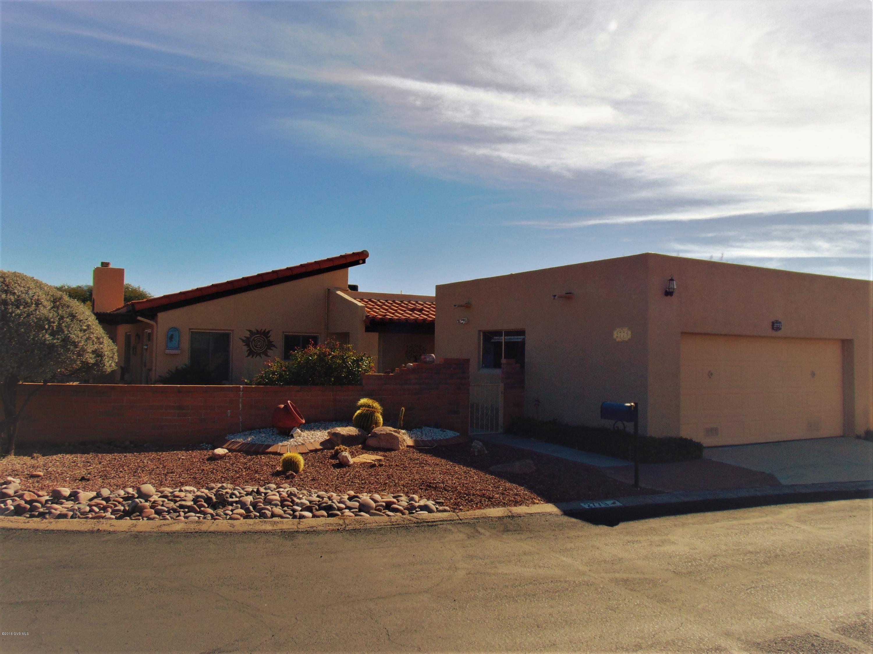 Delightful Senita model on corner lot! This townhome is located in the heart of the Desert Hills 5 subdivision. With 1700 sqft this 2bd/2ba + den is perfect for year around or winter retreat.Light and bright kitchen with granite counters, under mount single bowl SS sink, plenty of cabinet space and breakfast bar. Spacious great room with a gas fireplace and sliding doors to access patio that wraps around the back and side of home with mountain views. Formal dining room area. Master bedroom with tons of space, nicely sized walk-in closet and dual sinks in the master bath. The two car garage has plenty of extra space for storage. Brand new top of the line Trane AC unit with warranty. Double panel windows and screen doors. Close to GVR center and Elks. Furniture is available by SBOS.