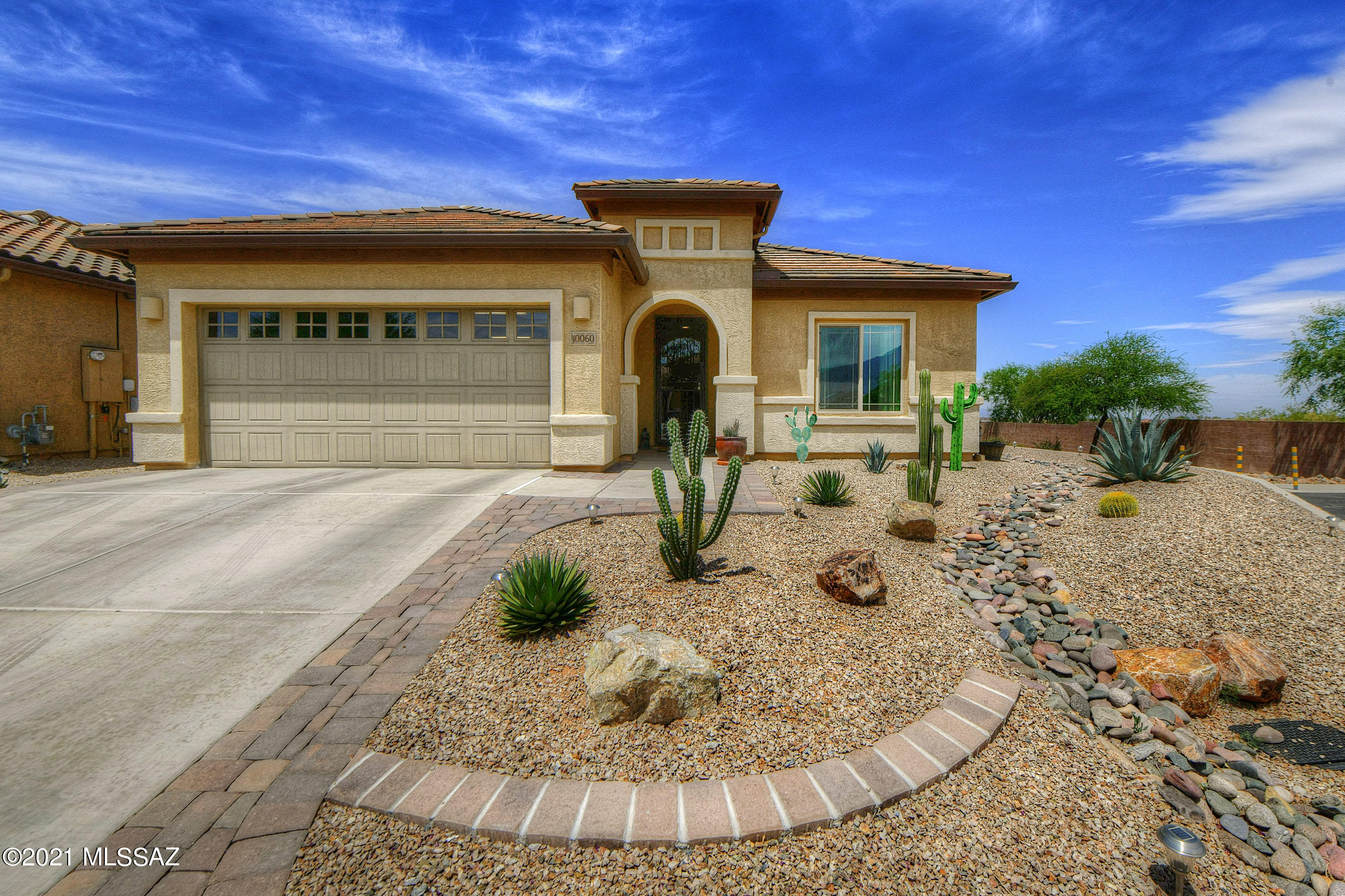 Beautiful 2 bedroom 2 bathroom home in like new condition!  Open floor plan with huge kitchen island and formal dining area.  Cooks kitchen with plenty of cabinets, countertop space and stainless appliances.  Split bedroom floorplan with Office/Den in the middle.  Tandem 2 car garage with plenty of storage space and tankless water heater.  Backyard boasts covered patio, pavers, and mountain views!  Gated 55+ Community, with tons of amenities & neighborhood features!