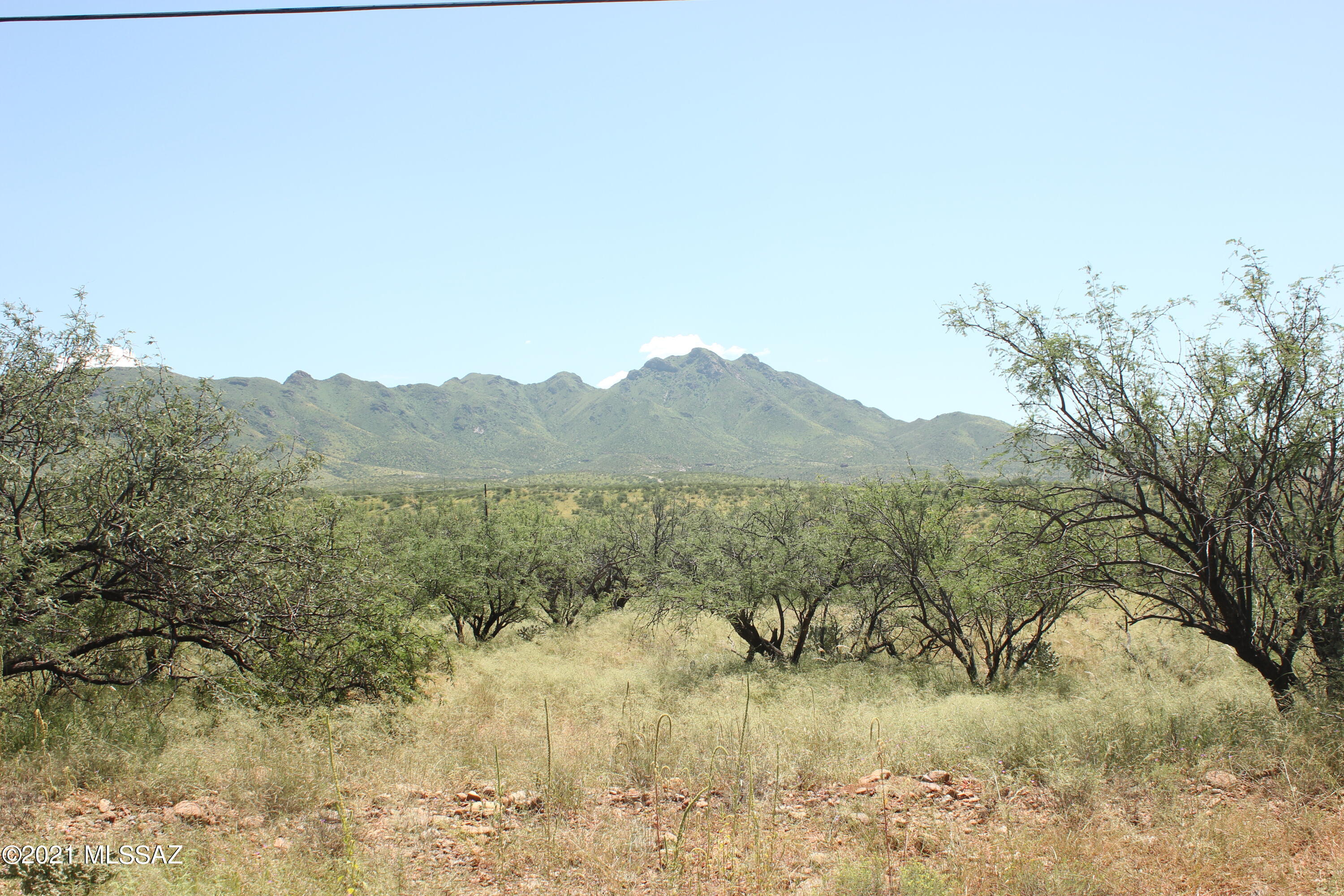 Lot is pretty flat and easy to build on.  All paved roads to get there.  Electric is at the street and most likely water is also but should be verified by the water co.  Mountain views.