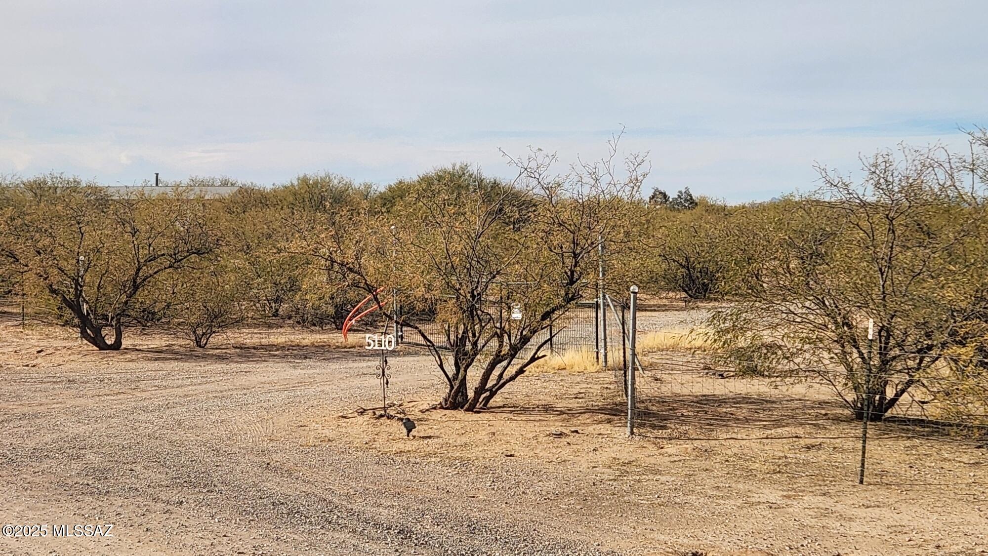 4.36 acre flat buildable lot. The property is fenced in on all 4 sides. 2 gates for access to a cleared lot. Water has been ran from lot line to home site. Electric Available at corner of property. This property is nestled in a very quiet neighborhood.
