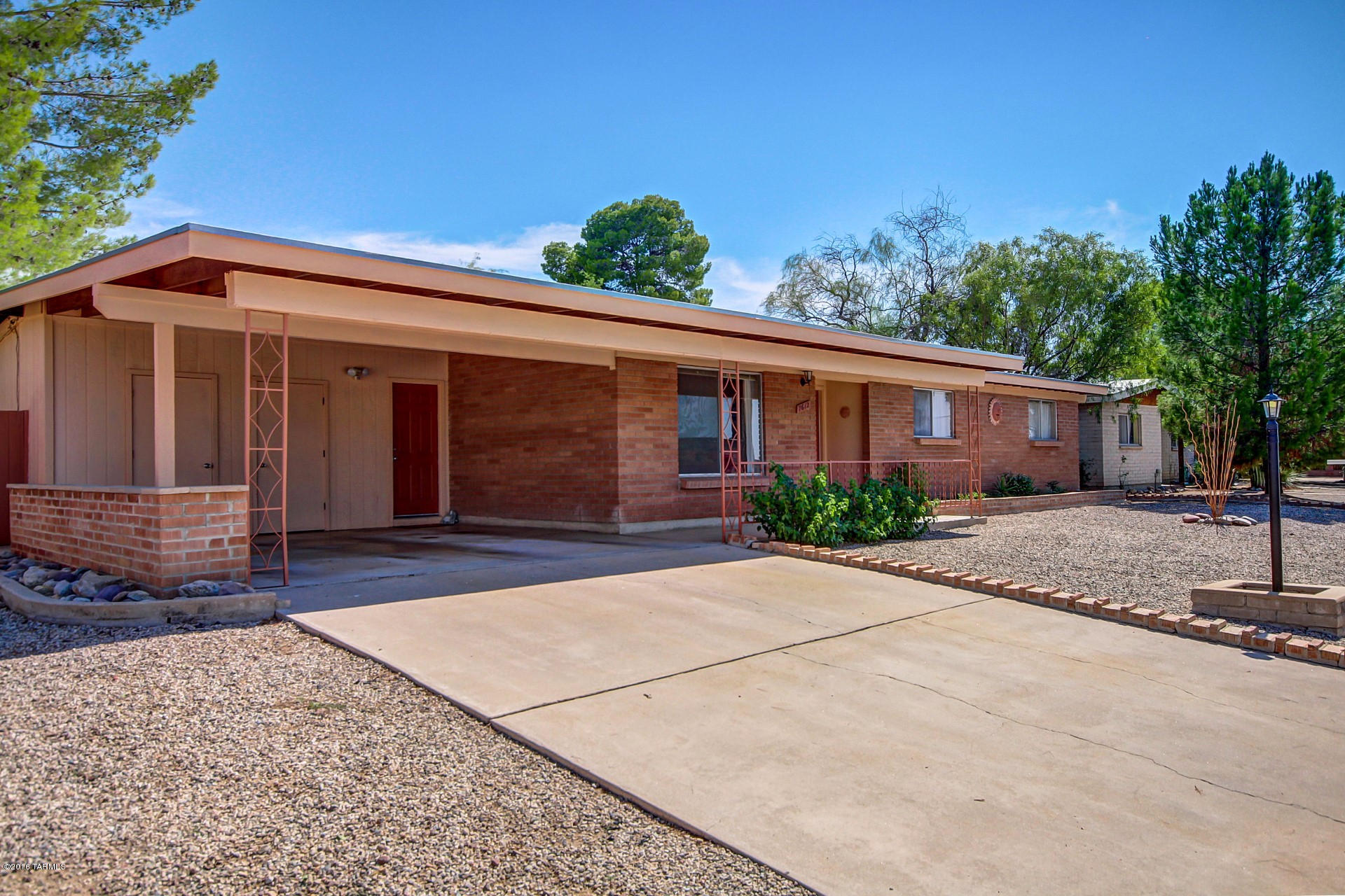 Beautifully maintained and updated home with pool and almost 1/4 acre lot . You will love the luxurious kitchen with custom cabinetry, rich granite counter tops & black appliances; spacious family room with garage, patio & pool access; sunset & mountain views; walk-in closets in all bedrooms; full-width covered patio overlooking mature yard with grass, citrus trees and refreshing pool. All in excellent condition! Roof is brand new and warranty transfers. Excellent location on quiet street yet less than 1 mile from Sabino & Tanque Verde shopping, entertainment, worship centers & park. Access to back alley & room for RV/toys. No pesky HOA!