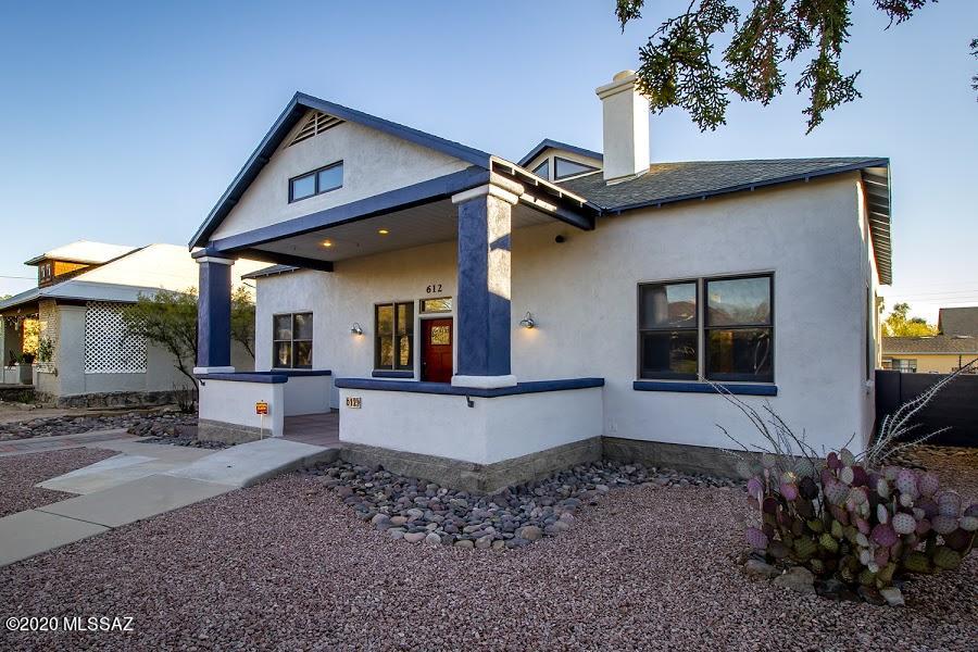West University home features 4 bedrooms, den, spacious greatroom/kitchen,  (master and 2nd bedroom and bath are downstairs), enormous walled yard, private garden, two car garage plus RV sized third bay, built in 1995.  This was a custom home designed by and for the family who lived here, following historic guidelines for an approved exterior that fits this historic neighborhood!  1/2 block to Roskruge elementary, three to Mansfeld and Tucson High, and UA main campus.  Couldn't be more perfect a location for those with education and back to in-person classes and activities in mind! Home is also fully ADA-accessible.  Spacious front and back porches, small roof decks upstairs. Ideal for a large family, or professionals/ professors wanting great office spaces at home, or for your UA students