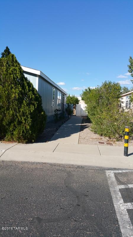 Great remodeled family home in gated community close to everything! Tucson Mall, great restaurants, everything you need is within a few miles of the home. New carpet, paint, kitchen cabinets and lots more.  nice quiet small neighborhood.  a must see!!