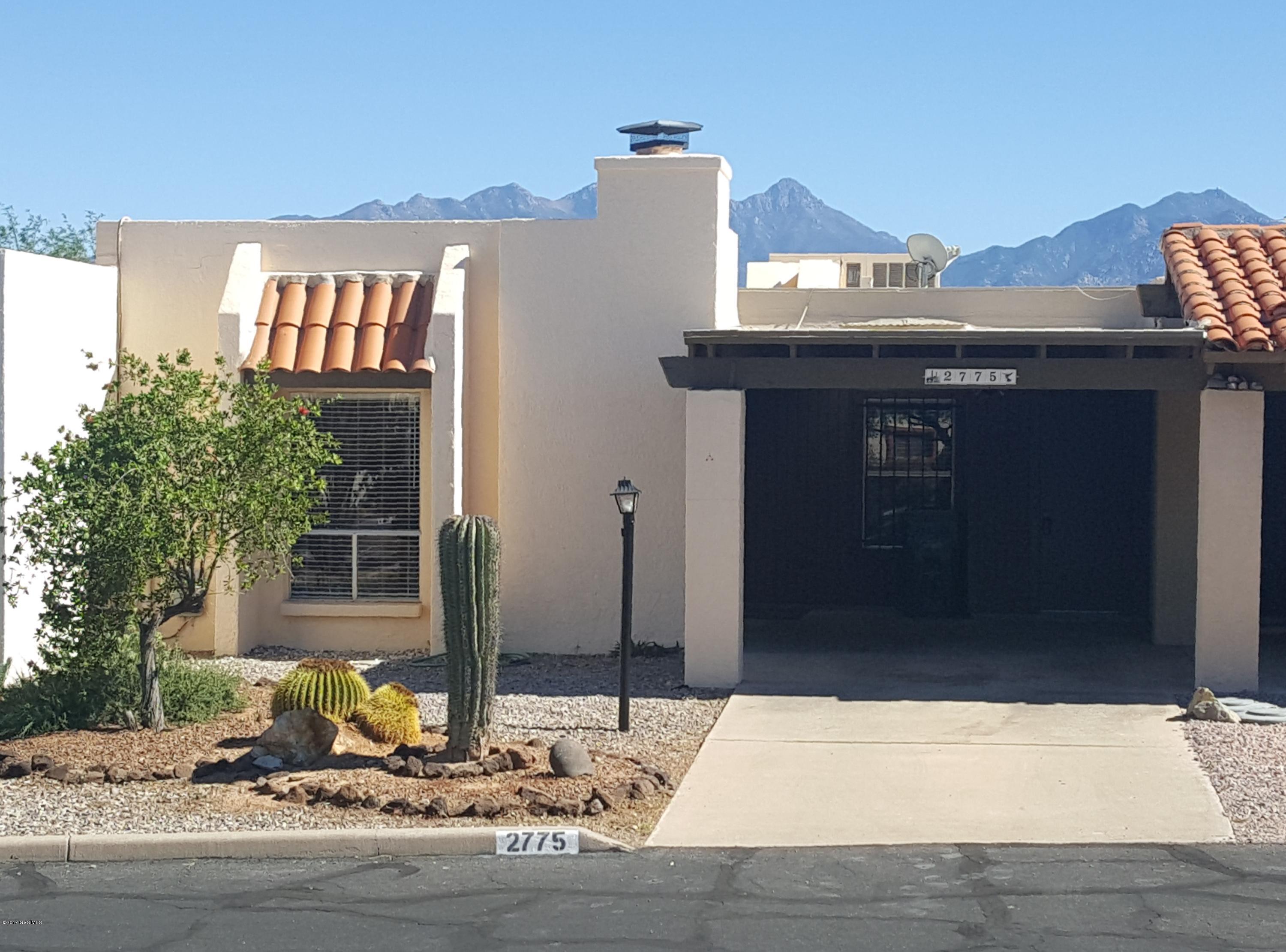 A beautiful mountain view and the sunrise to the east of the Santa Rita mountains to enjoy your morning coffee. All tiled throughout, this 2 bedroom, 2 bath townhome also includes new stainless steel appliances in the kitchen, new counter tops, and new washer & dryer. New interior paint through out and a kiva fireplace in the living room. Over flow guest parking is directly across the street.