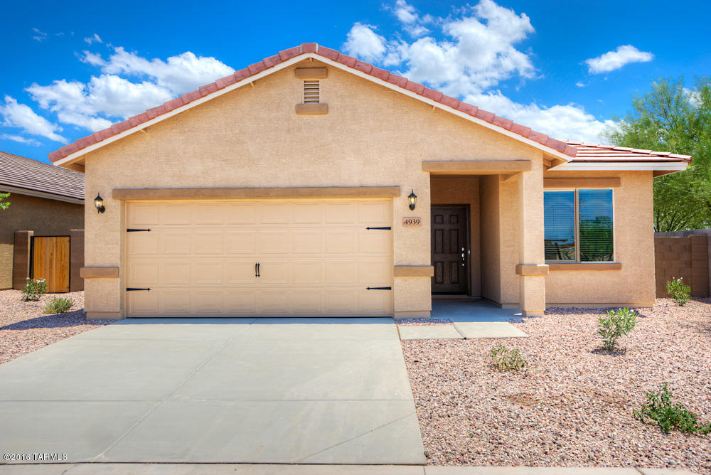 The Ajo floor plan is a spacious 3 bedroom, 2 bath single story home with over $10,000 in upgrades including energy efficient kitchen appliances, granite countertops, custom wood cabinets, brushed nickel hardware and an attached two car garage. Each of these beautiful homes comes fully-loaded with a private master suite complete with a walk-in closet, as well as a fully fenced backyard, large covered patio and front yard landscaping. This exceptional home is located within the amenity-rich community of Sonoran Ranch, featuring miles of walking trails, as well as a park with a children’s playground and a spacious picnic area, providing an extraordinary lifestyle for you and your family.