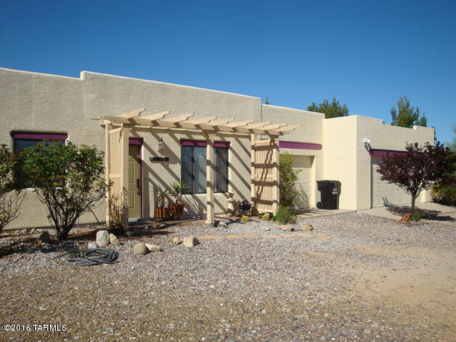 Price Reduced! Country Living on over 1.3 acres in the Diamond Bell subdivision in the foothills of the Sierrita Mountains overlooking the Altar Valley. 3 bed, 2 bath, 3 car garage Home away from the traffic, hustle and bustle of the City. Quiet, dark skies and views of Kitt Peak. Underground Utilities. Lots of upgrades, skylights, ceiling fans, storage shed and dog run/kennel. All tile floors and horses allowed if you choose. Natural Sonoran Desert vegetation and landscaping. Come and see...