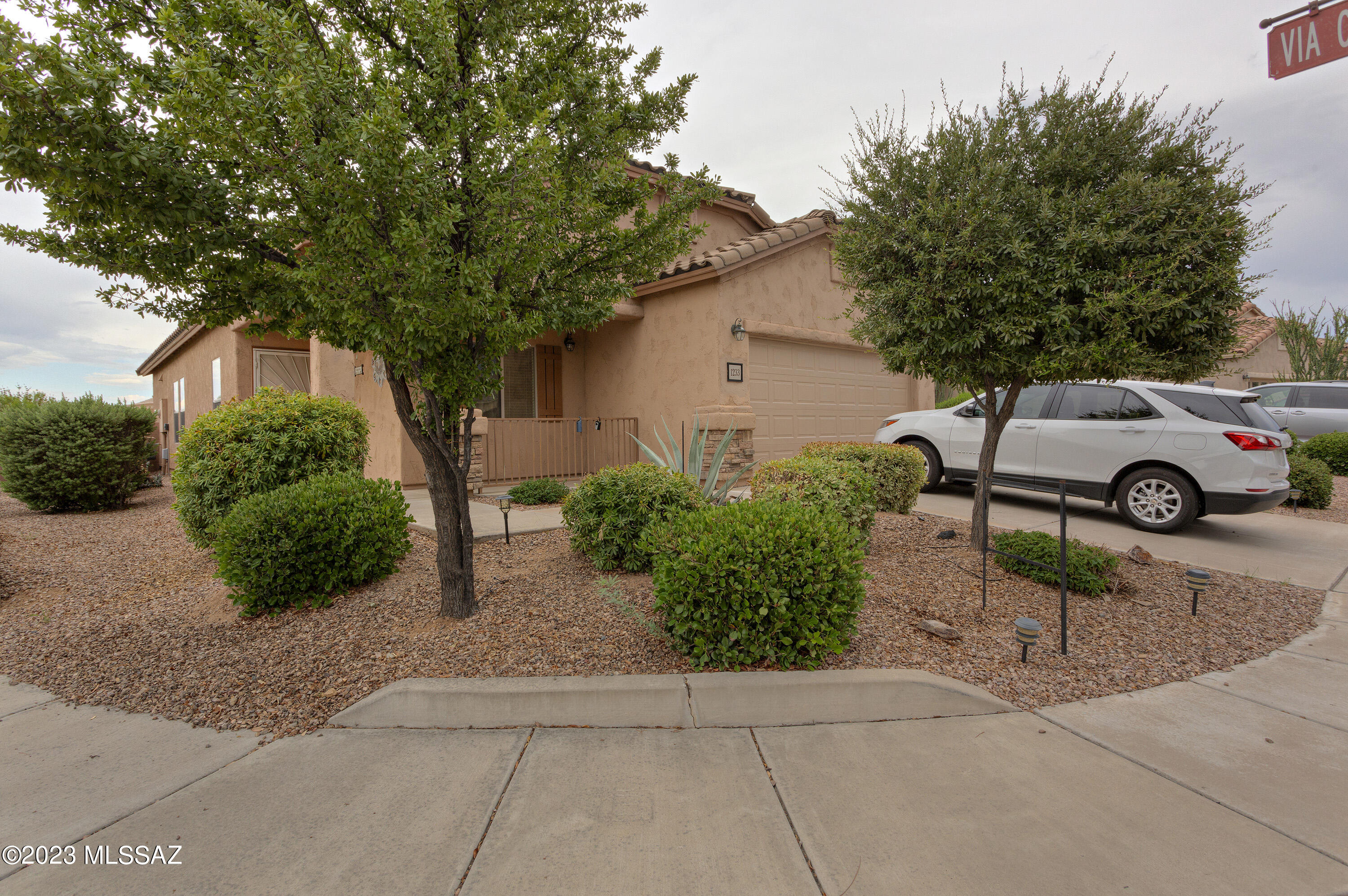 Wonderful corner lot with south back yard. 2 Bedrooms and Den. Double garage. Eat in kitchen. Tile roof. Many community amenities.