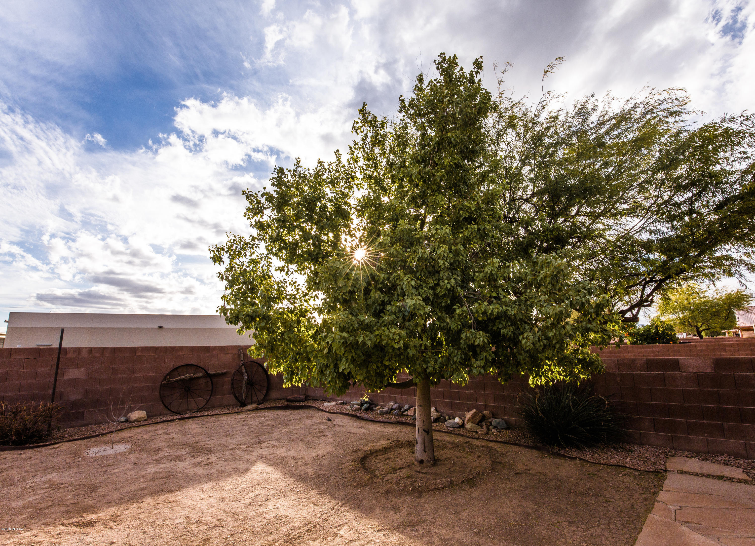 4 bedroom, 2 bath home with 12 foot vaulted ceilings throughout except for two bedrooms. 17'' tile in brick pattern, neutral paint, large luxurious master with ensuite, dual pane windows, security screen door, tile roof, central alarm, plumbed for a soft water system, and keyless garage opener with soft, quiet close door. Back yard has drip system, extended flagstone patio and storage shed.