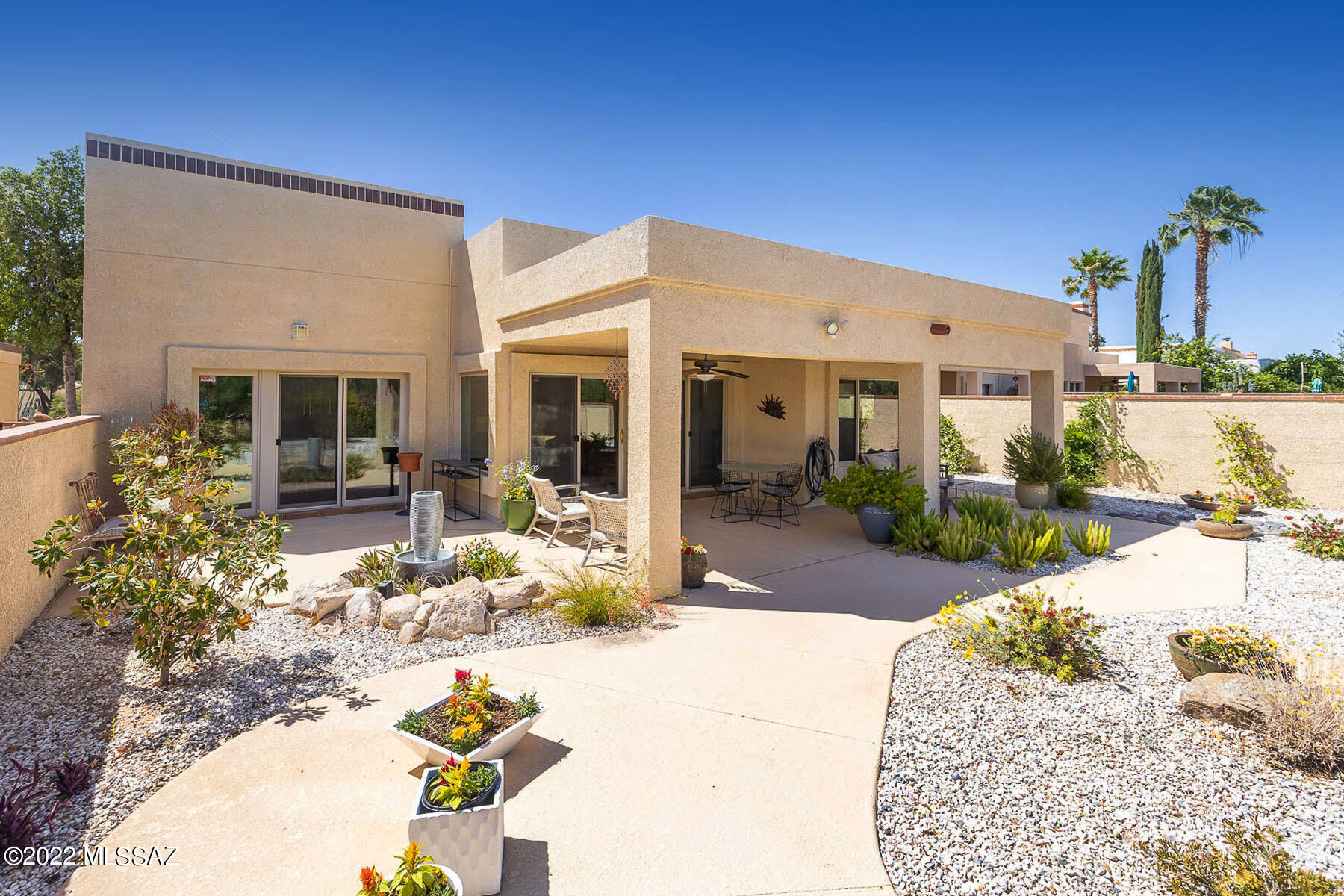 Beautifully redone detached townhome in desireable Omni Tucson National offers fabulous Catalina mountain views.  Home has been completely redone with new floors, kitchen, bathrooms, HVAC, roof and landscaping. Lots of natural light, big living room with tall ceilings and fireplace. Comfortable covered patio offers privacy & beautifully landscaped backyard backs to wash with incredible mtn views.   Kitchen features light wood custom cabinets, lots of storage and prep space, induction cooktop/range, stainless steel appliances, island and mountain views from windows. Roomy dining room w/ mtn views. Spacious main bedroom offers motorized blinds, slider to patio & luxurious bath with dual vanity, his/hers walk-in closets, beautiful shower & huge linen closet. Generous guest bedroom + office