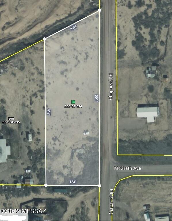 Make an Offer... Owner will Carry... Nice flat property in an established neighborhood almost ready to build your dream home or bring in a MFH. Some fencing, mountain views not far from town.  There was once upon a time a home on the property.  There is a septic and a collapsed well on the property, and electric within 500'.  Bring all offers.
