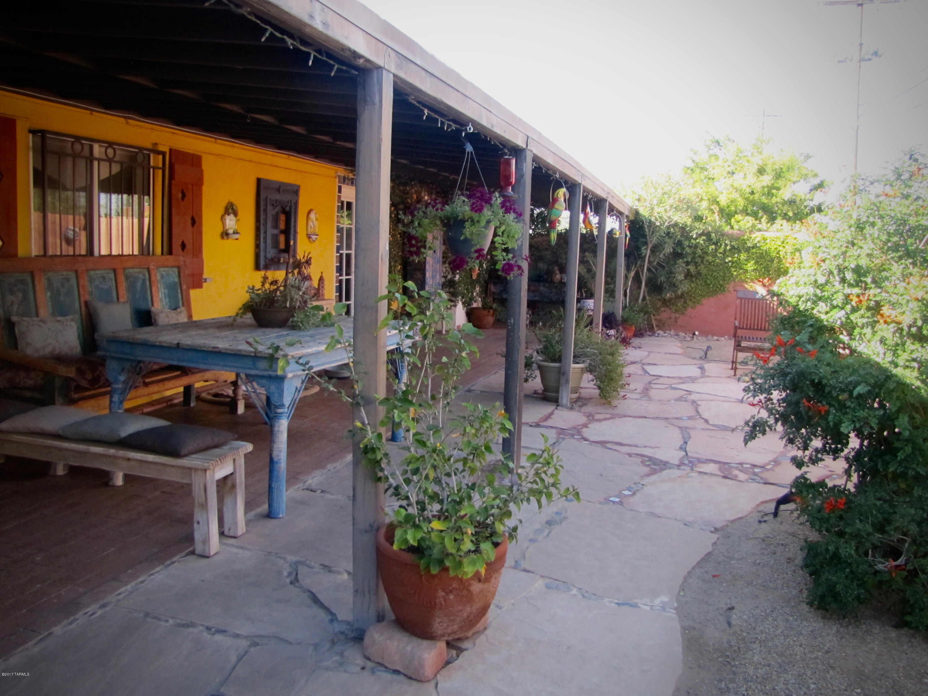 Ready to move-in, home located centrally in Poet's Corner!  Mountain views, wood burning fireplace, garden oasis and more! This must see home includes a 55' covered patio,  Courtyard with large pool, separate storage building or workroom w/electricity and parking  for an RV or boat.