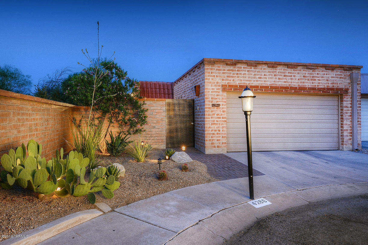 Limberlost townhome II,burnt adobe,2 bedroom,2 baths that is beautifully renovated.Beveled glass divided light-dual pane windows & single light doors throughout. Whole house Custom built in Cherry cabinetry & blue pearl granite throughout. Custom built in office w/Murphy bed,  porcelain tiled floors set on diagonal, Well appointed kitchen, w/blue pearl granite & Cherry wood cabinets,newer SS appliances include separate 2 drawer under counter refrigerator & dual fuel stove,great room floor plan w/built in entertainment center surround sound inside & out,Upgraded Robern Uplift lighted medicine cabinets in each bathroom,reostat lights & recessed lighting throughout, patio w/Belgarde brick pavers & an outdoor built in gas BBQ right next to large common area pool! 2car garage & rolling shudders