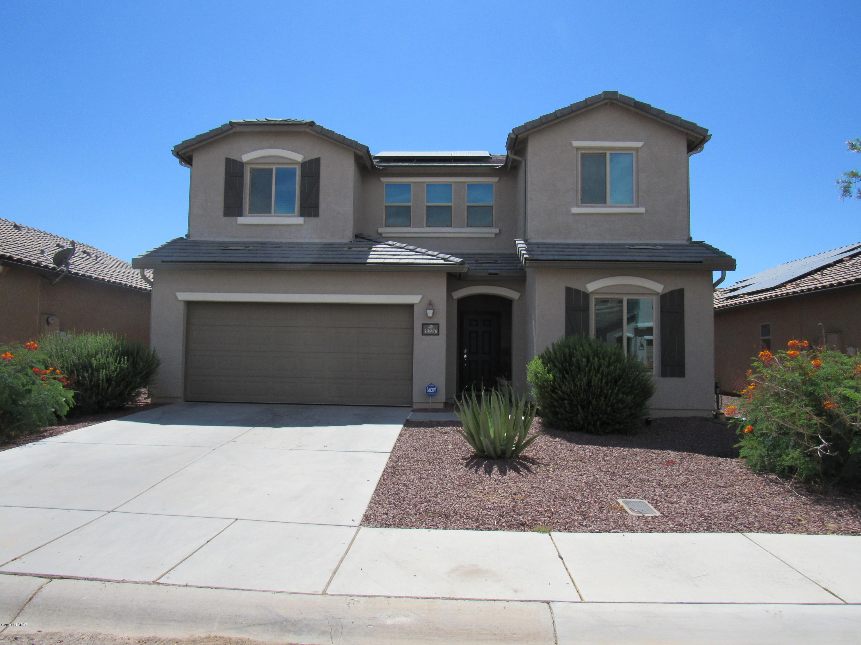 Wonderful home in Red Rock community. Move in ready with granite kitchen counters, tile floors, walk in pantry and owned security system. 2 bedrooms and a spacious loft upstairs, master bedroom and den downstairs. Leased Solar panels will save you $$ with all the AZ sun. Upstairs and downstairs wall mounts stay. This house is not to be missed! Seller to contribute $500 towards backyard landscaping.
