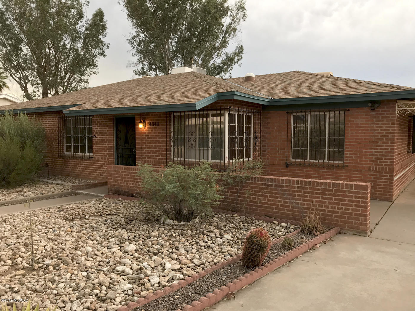 Double wire cut brick with great curb appeal near Hoffman Park. Built in cabinets with glass in formal DR. Kitchen is sweet with lots of room to exercise your culinary creativity! Security Bars on doors & windows. Bonus Room off Living Room can be office, meditation or exercise room or even a 4th Bedroom! (very large room) behind room is laundry room. Huge back yard cute gazebo. Large workshop/storage shed. This solid home is conveniently located in midtown. Put this one at the top of your tour!