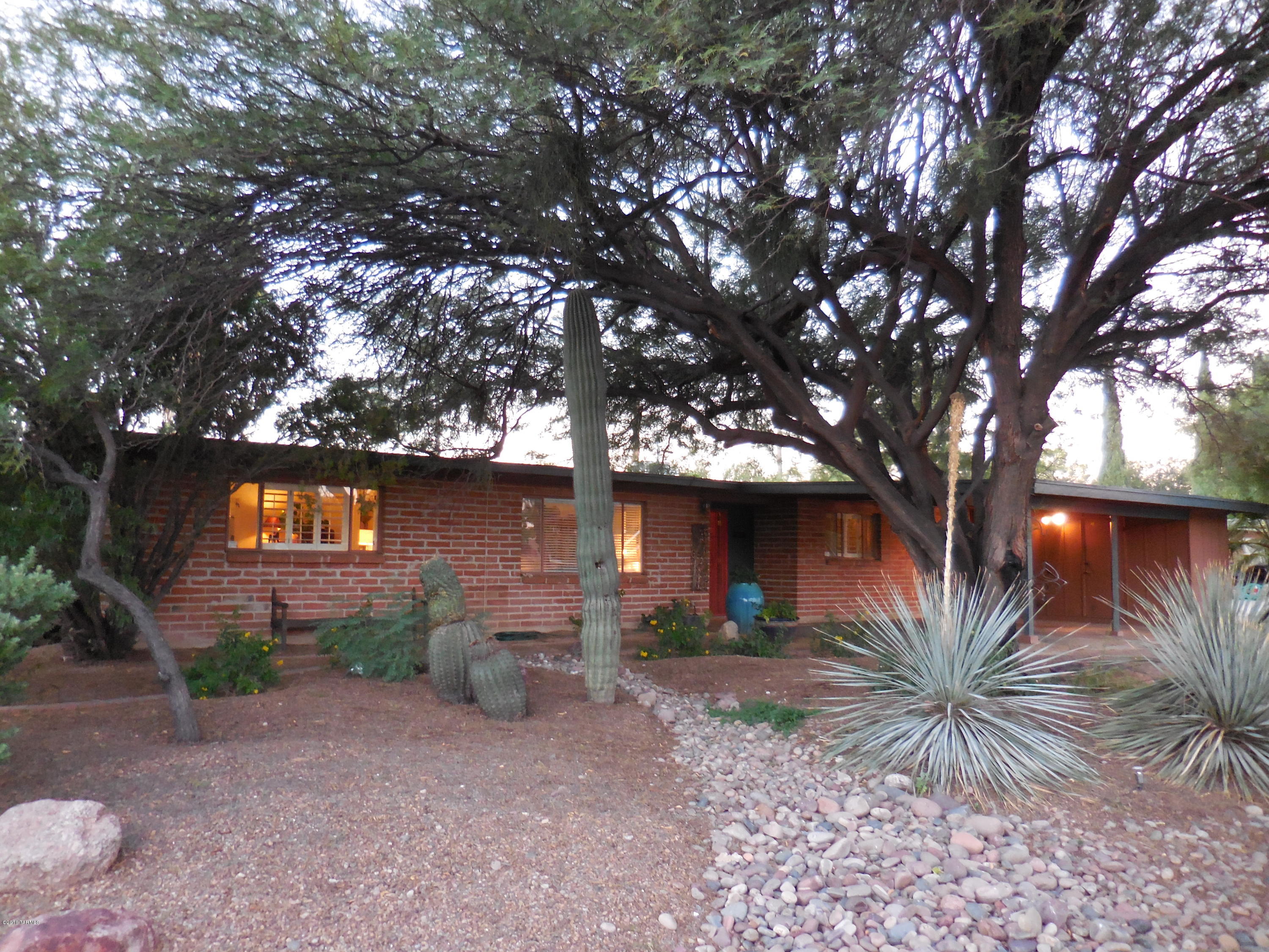 Fantastic burnt adobe home in desirable central Glenn Heights neighborhood.  Kitchen adjoins family room with fireplace, formal dining room, and living room.  Wonderful master bedroom has sitting room.  Lush back yard enclosed with block wall.  One of the first neighborhoods in Tucson to boast streetlights and sidewalks. Walking distance to Rillito River Park, Plaza Palomino, Crossroads Festival, Fort Lowell Park, historic San Pedro Chapel, and TMC.  Don't wait on this one!