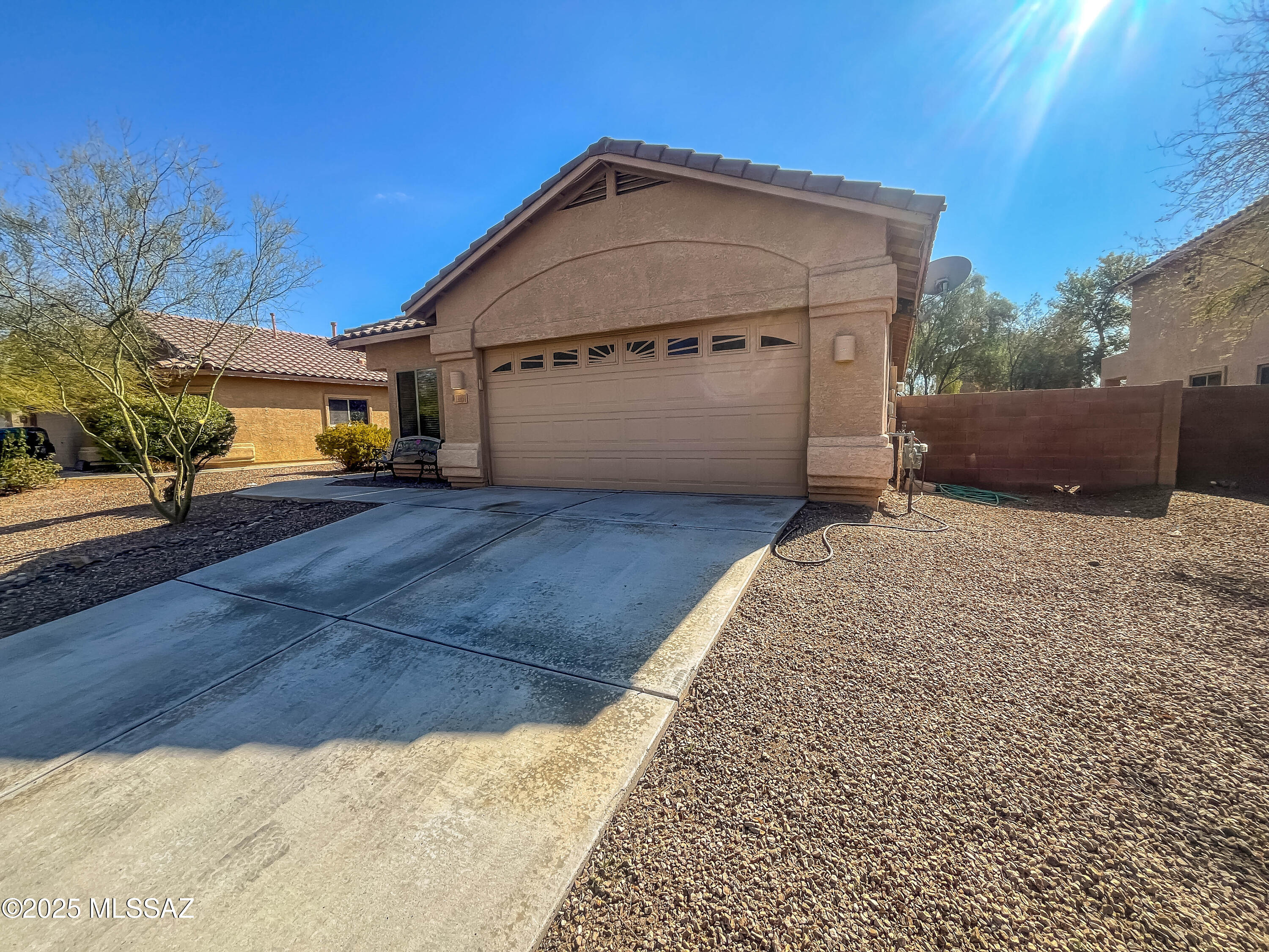 Experience comfortable living in this charming 1532 sq/ft, 3-bedroom, 2-bathroom home located in the desirable Rancho Marana community. This home features tile flooring throughout, with cozy carpeting in the bedrooms. Enjoy the convenience of ceiling fans in every room, a formal living room, and a formal dining room complemented by a breakfast nook off the kitchen. Additionally, there is a separate laundry room and a spacious 2-car garage. The property boasts a generously sized yard with mature trees, perfect for outdoor relaxation and entertainment. It is situated within the reputable Marana school district.