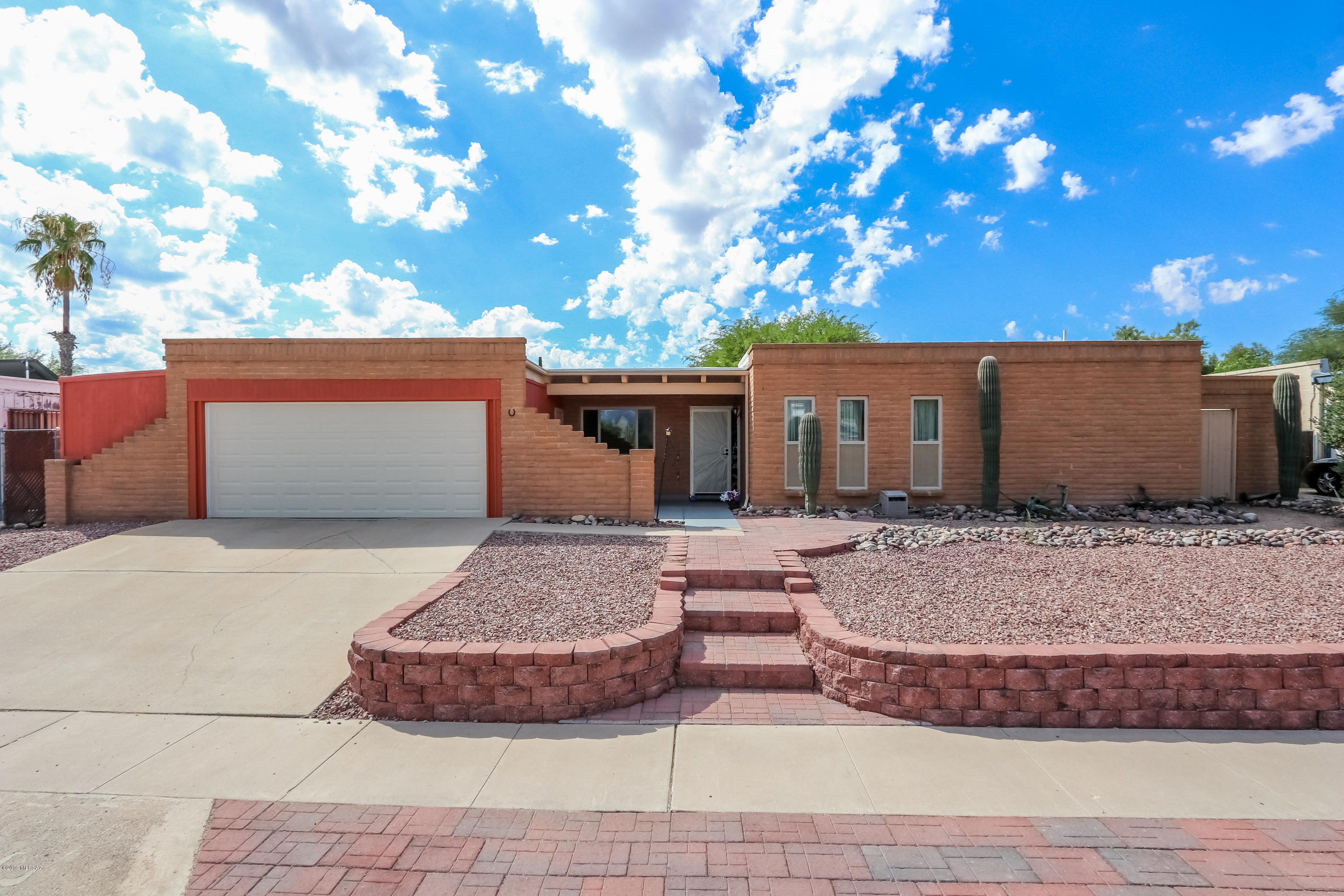 This Home Is A Must See! Well maintained ranch style home with 4 bedrooms, 2 bathrooms. Energy efficent windows, upgraded with oiled bronze fixtures, granite counter tops throughout. Wood laminate and neutral tile flooring. Master bedroom has a beautiful barn door separating the master bathroom and walk in closet. Raised panel cabinets in the kitchen with double sink, granite and stainless steel appliances. Large covered patio, recently surfaced pebble tec pool with new tile and stairs. Brick paver entertainment area with artificial grass. 2 car garage with extra space for a workshop. Custom rolling iron gate in the backyard for easy access. This home has so much to offer. 3 year roof certificate.