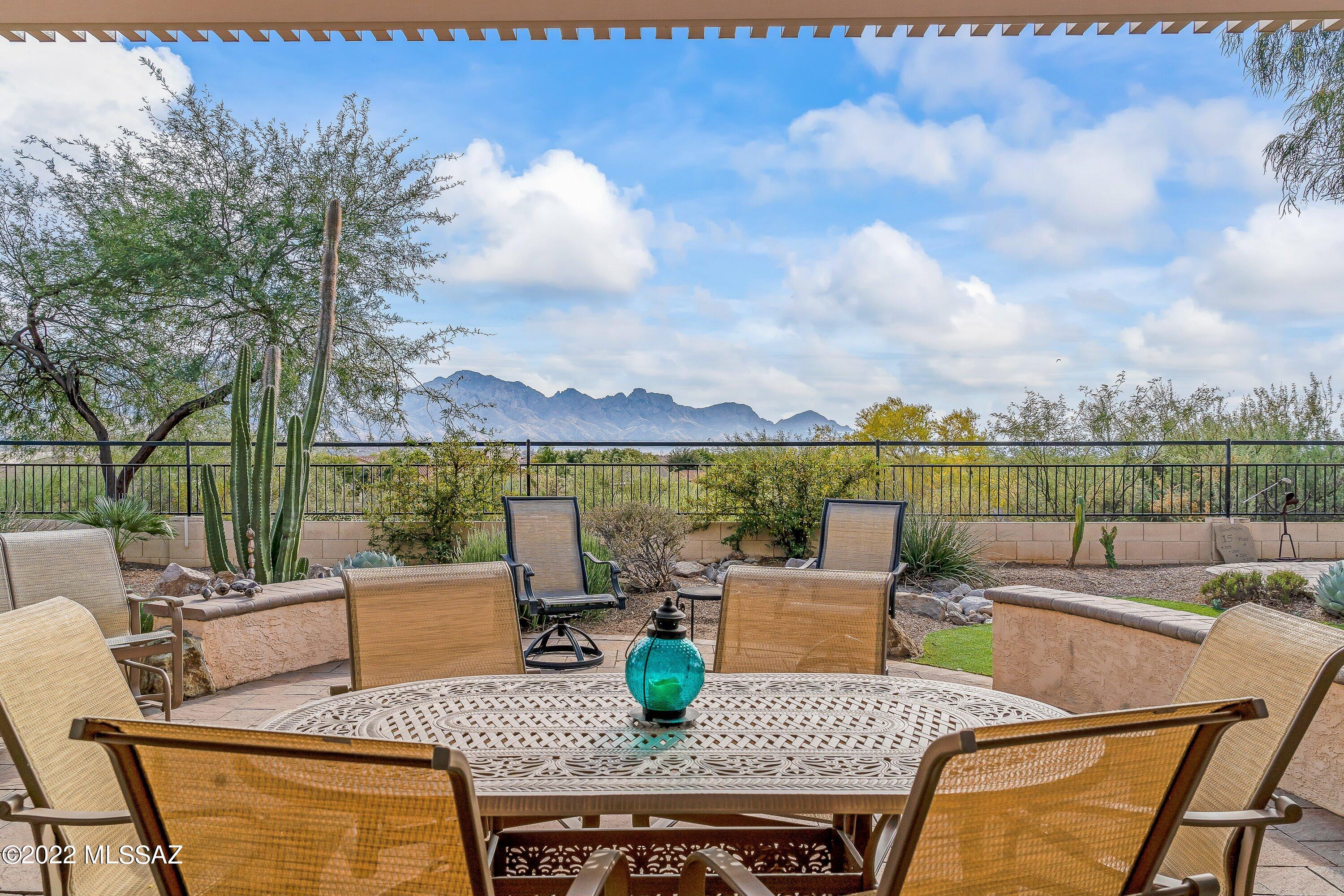 Wonderful mountain views, both inside & out, welcomes you to this highly upgraded Dakota model w 3 Bedrooms & 2 Baths. Spacious great room takes full advantage of the views. Redesigned & upgraded kitchen w cork flooring, stainless appliances including induction cooktop, quartz counters & plenty of cabinetry. Open family room has inviting window seat overlooking unobstructed mountain views. Owner's retreat has mountain views & en-suite w double vanities, soaking tub, separate shower & walk-in closet. Two guest bedrooms, one w built-in desk & cabinets plus guest bath. Backyard oasis features covered patio with solar shades & expanded hardscape with Ramada providing plenty of entertaining space while taking full advantage of the great mountain views. Come enjoy the SaddleBrooke lifestyle.