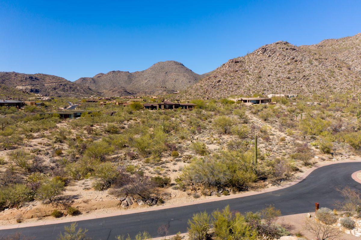 Capture the mountain views from every window in your new home on this 1.6 acre custom estate lot.   Desert wonderland surrounded by lush the lush Sonoran Desert - soaring saguaros and ancient rock formations comprise the breathtaking views.  This beautiful level lot is located in a quiet cul de sac in  the very desirable Canyon Pass at Dove Mountain.  It's a guard gated luxury community located in the Tortolita Mountains with lovely custom homes built throughout the canyon.  Outdoor enthusiasts will appreciate the nearby hiking and golfing (near the Gallery Golf club and the prestigious Ritz Carlton).   Shopping is also not far!    Priced to sell quickly.  Bring your builder or investment/ spec opportunity.   CANYON PASS IV-A @ DOVE MOUNTAIN LOT 0209