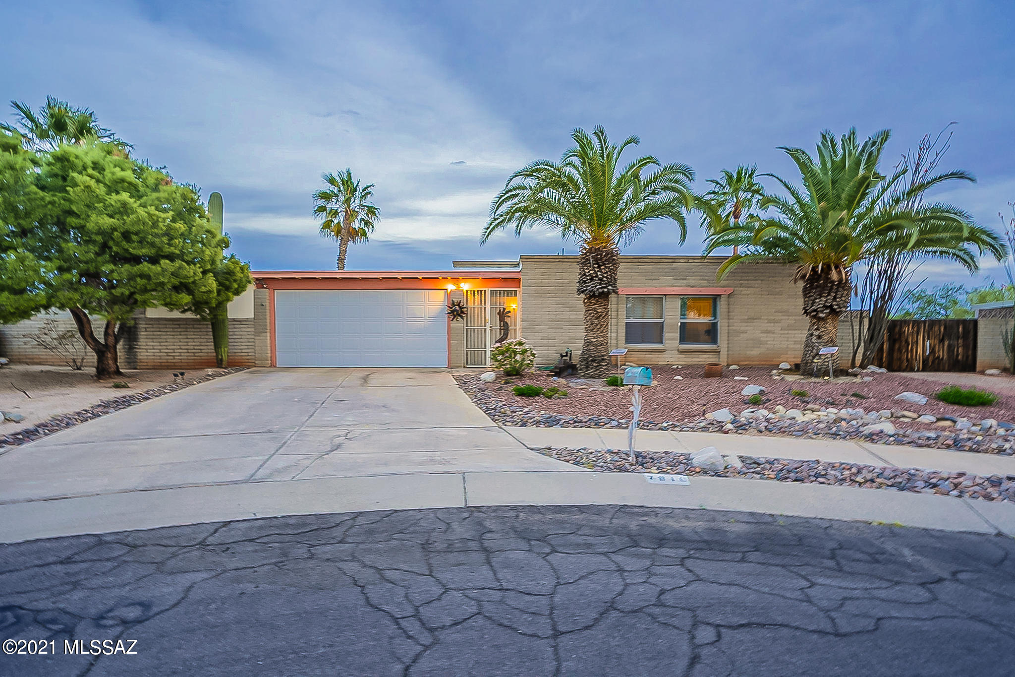 Enjoy fantastic city and mountain views of five mountain ranges from this hill top home.  Pride of ownership with wood plank tile in family room and all bedrooms, crown molding in family room, and custom built bar.  Large Kitchen with Catalina Mtn & Rincon Mtn views, granite counter-tops and granite backspace,  newer electric cooktop/stove, new Frigidaire Stainless Refrigerator.  Both bathrooms  are gorgeous, have been remodeled with new tile, and  new vanities. Pool area with beautiful mountain, and city views.  Fantastic cul-de-sac, NO HOA, parking on side of house for RV or toys w/ 30 amp hookup.