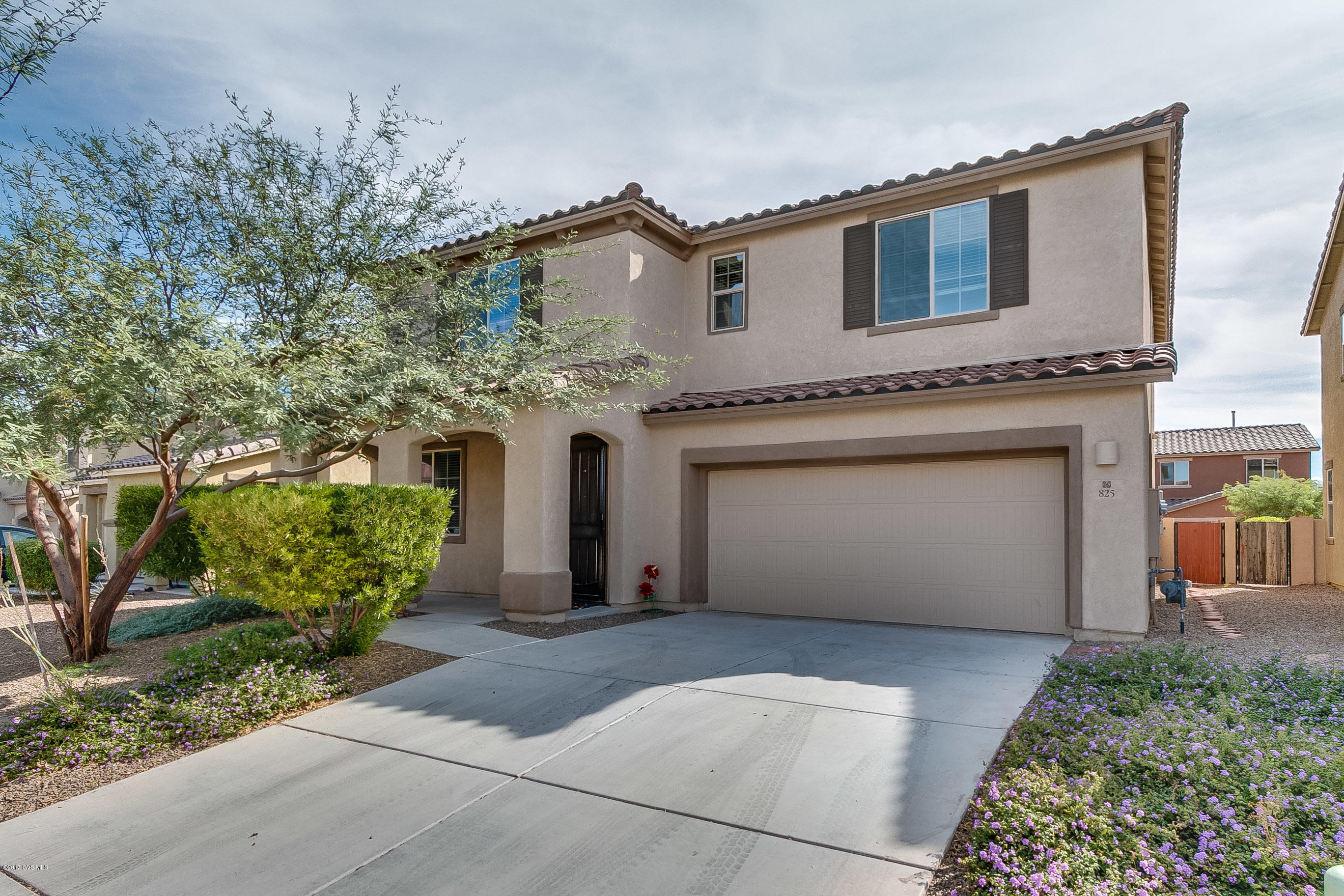 Stunning 5 bedroom, 4 bath home in Rancho Sahuarita with all the amenities! Spacious flexible floor plan boasts of a formal living room (formal dining or home office) to greet your guests. Grand kitchen features stainless appliances, granite counters, rich cabinetry, huge walk-in pantry and a massive breakfast bar island. Open floor plan flows into a dining area and large family room. Downstairs bedroom and a guest bath. All 5 bedrooms have walk-in closets. Upstairs you'll enjoy the loft/game room. Generous master suite with luxurious master bath with 2 BIG walk-in closets. Don't miss the JUNIOR SUITE with ensuite bathroom. Two more bedrooms, family bathroom and a convenient upstairs laundry room complete this gorgeous home. Relax under the covered patio & enjoy the green faux lawn & mor