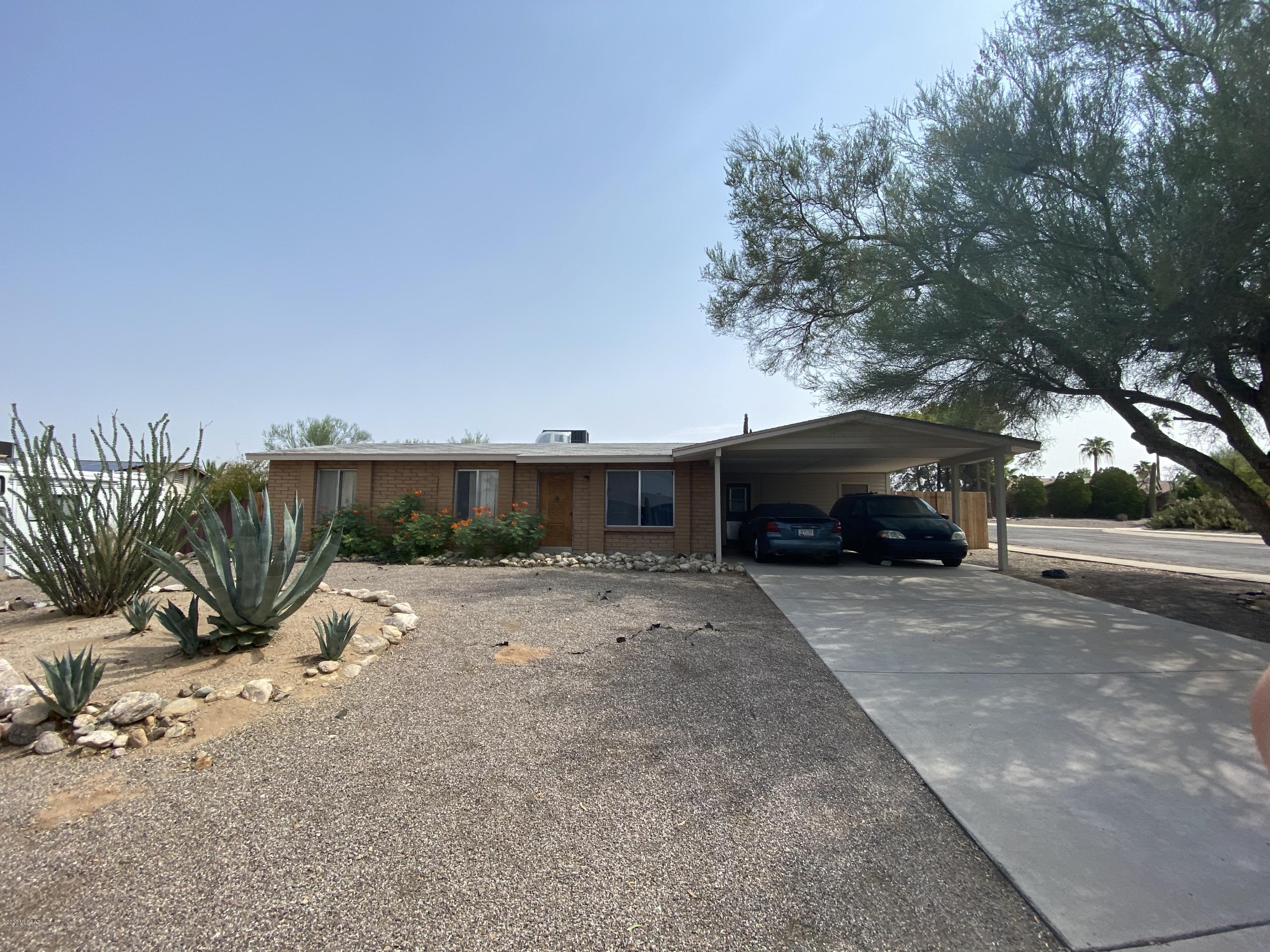 Wonderful 3 bed 2 bath home with HUGE backyard and no HOA. This well-maintained solid block home features ceramic tile and wood floors throughout main living areas, newer carpet in bedrooms, and newer central AC/heater. Master suite includes on-suite bathroom w/upgraded walk-in tiled shower. Nice size guest bedrooms, with updated guest bathroom tile surround. Oversized lot (.22 acres) with spacious backyard perfect for entertaining and a large storage shed.  Full of potential; a must see.