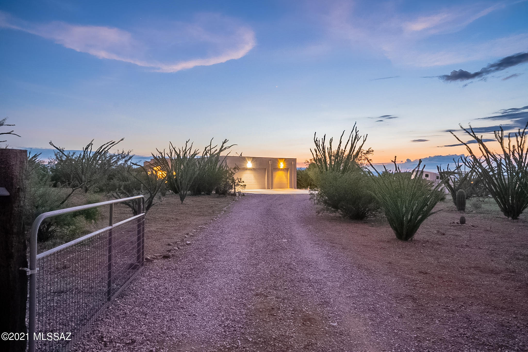 Sprawling 4.45 Acre horse property with stables, washing rack and TWO arenas! Custom 3 bedroom 2 bath, 1600 Sq Ft home with 3 car garage. Bright and open split floor plan with beautiful tile floors throughout. Spacious kitchen adjacent to the dining area with tile backsplash and convenient laundry closet, doing dishes will be a joy with these gorgeous views. Master suite with his and her closets, private access to the patio, more tile in its private bathroom, large walk in shower and unique copper sink. Updated Electrical and hall bath. Enjoy the 360 degree views from your front or rear covered patio with fan. Bring your RV, boat and toys, HOA maintains road only. Located in the award winning Vail School District.