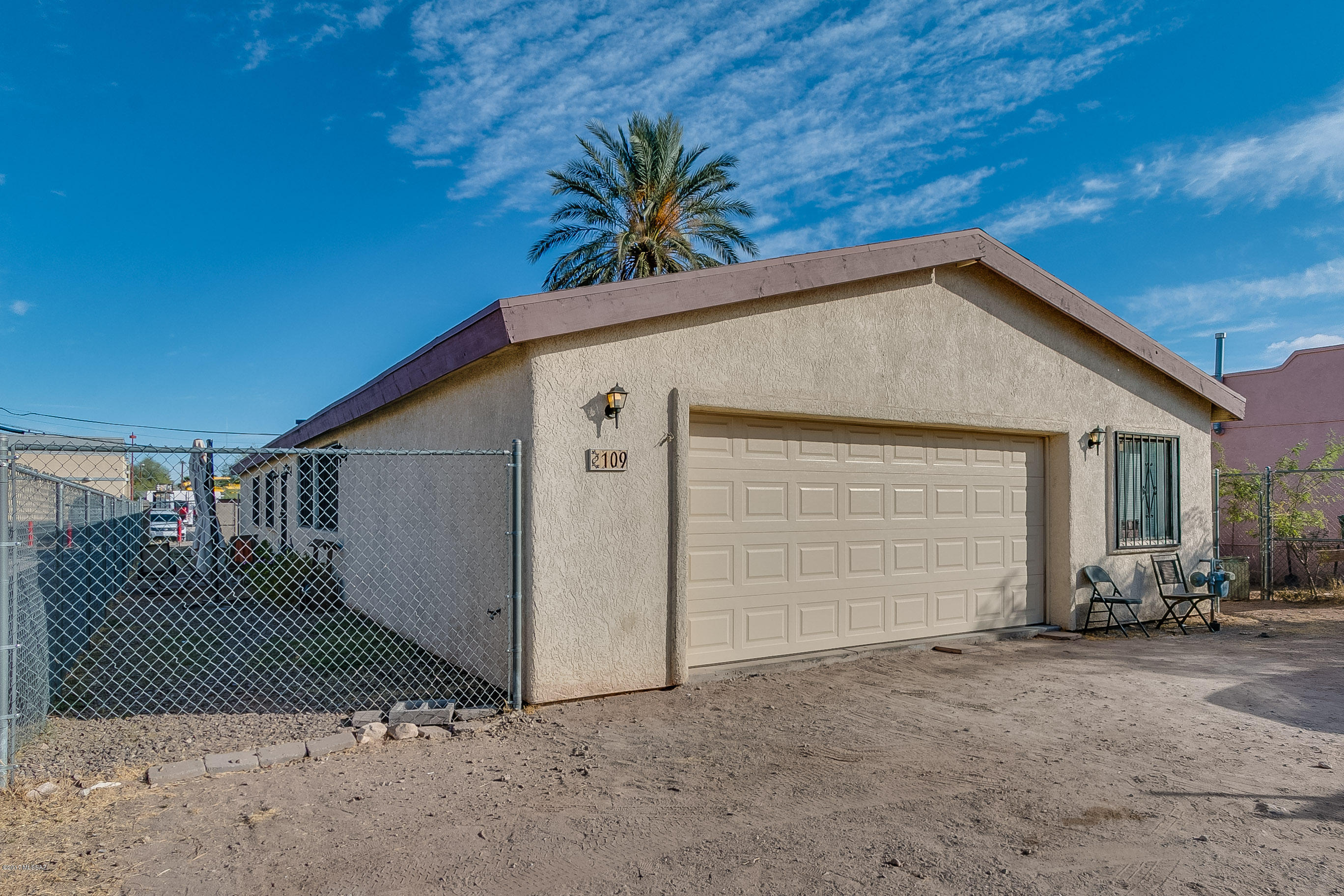 Don't miss the opportunity to view this 4 bedroom 2.25 bath 2076 square feet home built in 2006. Ceramic tile. Ceiling fans in all 4 bedrooms plus great room. Lots of kitchen cabinets. Air conditioning. Over-sized great room. Extra Large 2 car garage with workshop area, sink, and cable outlet. Wrought iron window and security bars. Back yard access from alley for cars, work trucks, or RV. You will be hard pressed to find a house this size for a lower price!