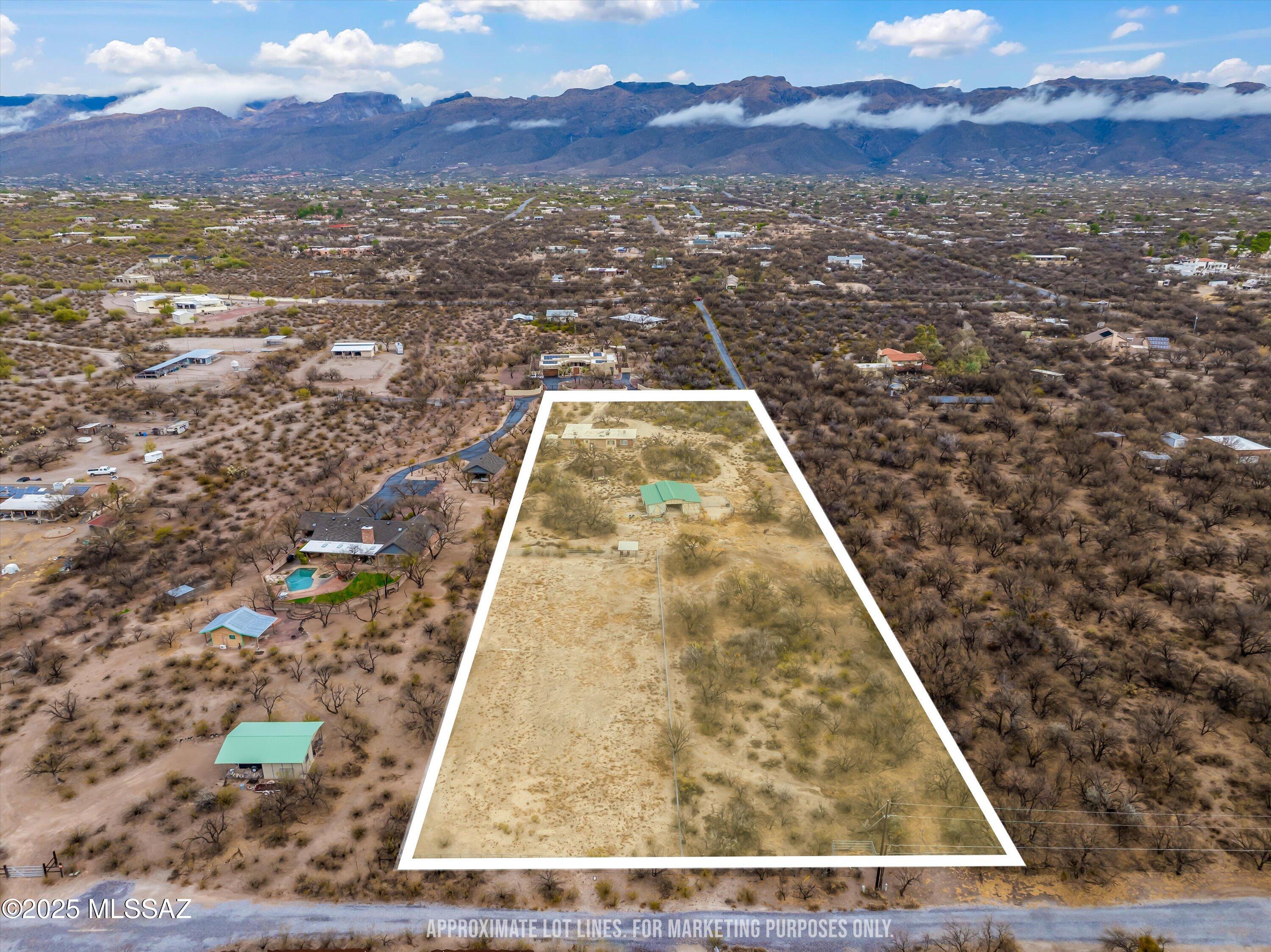Presenting an exceptional Investor opportunity. This scenic and serene horse property on 3.3 Acres is located in the heart of Tanque Verde and offers an incredible investment or redevelopment opportunity. Whether you renovate the existing 1-bedroom, 1-bathroom 1100 sq.ft. home or start fresh with a custom estate and equestrian facility, this property is a rare find. Equestrian amenities featuring a stable with 4 stalls, a tack room, a lighted arena, and high-end galvanized pipe fencing surrounding the entirety of the property. The level terrain makes it ideal for additional equine facilities, training areas, or a custom barn. Enjoy breathtaking sunrises and sunsets over the Catalina mountains, a private and peaceful desert retreat while still being close to city conveniences. Water, electricity, and septic are already on-site, making development seamless. Minutes from riding trails, Saguaro National Park, Sabino Canyon, Mt. Lemmon, top-rated schools, shopping, and dining. With unlimited potential, no HOA restrictions, and prime equestrian facilities, this is a must-see opportunity for investors, horse enthusiasts, and developers alike. Schedule your private tour today!