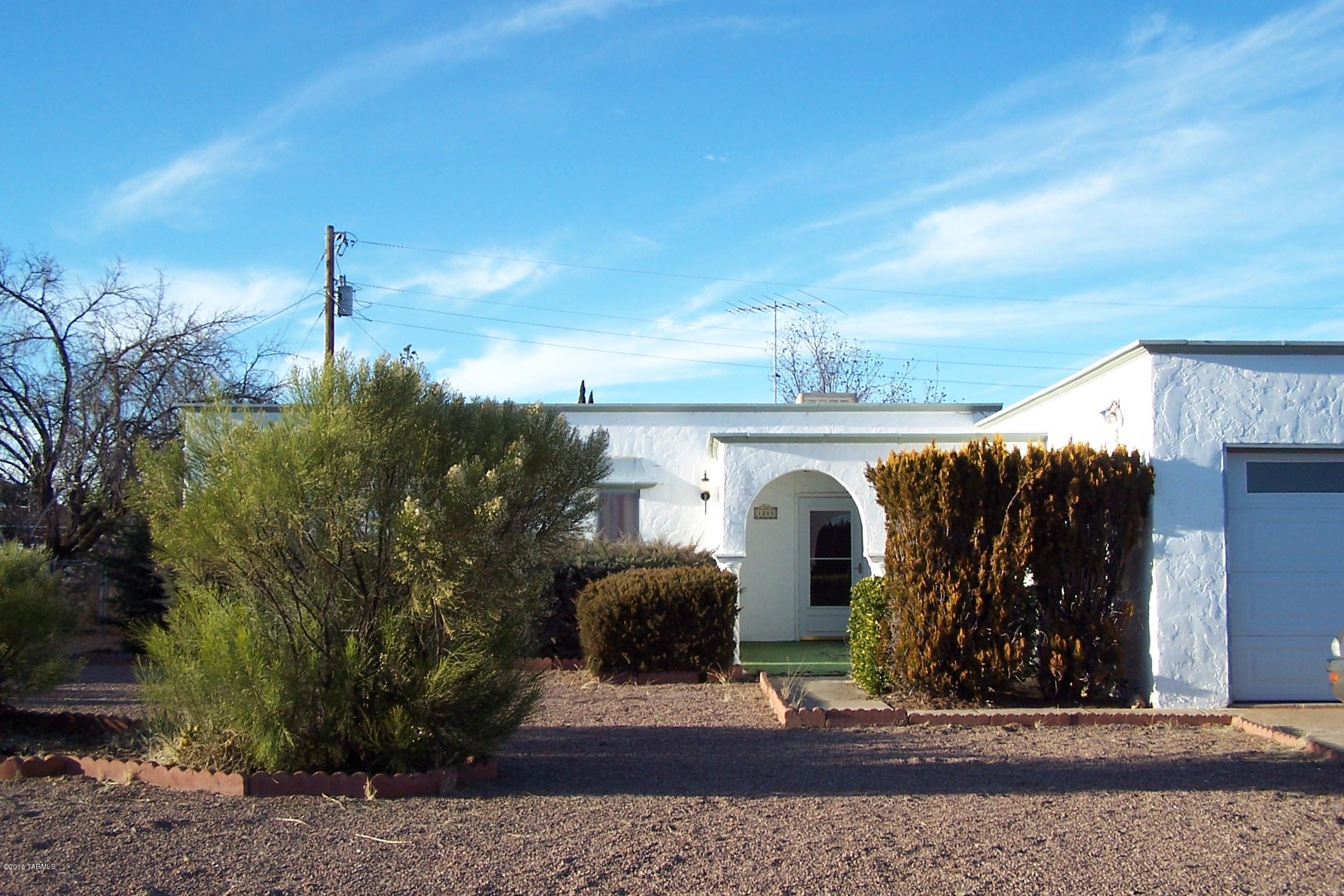 Nice Santa Fe home is the Sunsites Village close to shopping, fuel, restaurants, library and more.  This 3 bedroom 2 bath has fresh paint, partial new roof with warranty.  Nice size rooms, fireplace in living room.  Covered back patio.  Please bring all offers.
