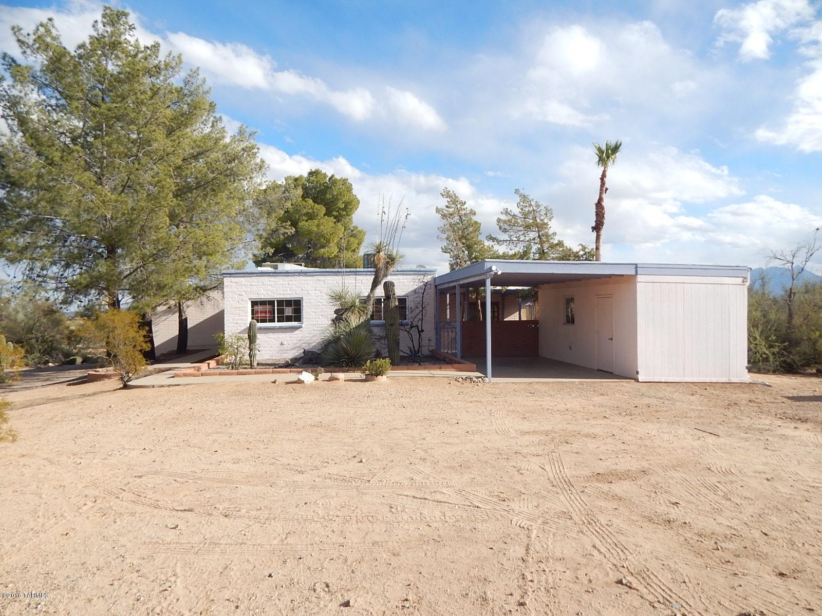 This is a Fannie Mae HomePath property. With 2376 sq ft of living space on 4.68 acre lot, this home has 2 bedrooms, 2 bathrooms, extra room, Workshop, master Suite & family room with fire place & large backyard with covered patio great for entertaining. Enjoy the spacious kitchen with plenty of cabinet space that opens to dining area and family room. <FONT COLOR=RED> Recently painted interior with two tone paint.</FONT>  Located near I-19, restaurants, shopping and much more! Attention First Time Buyers: complete the HomePath Ready Buyer homeownership course. Attach certificate to offer and request up to 3% closing cost assistance. Ask Agent for more details. Restrictions apply.