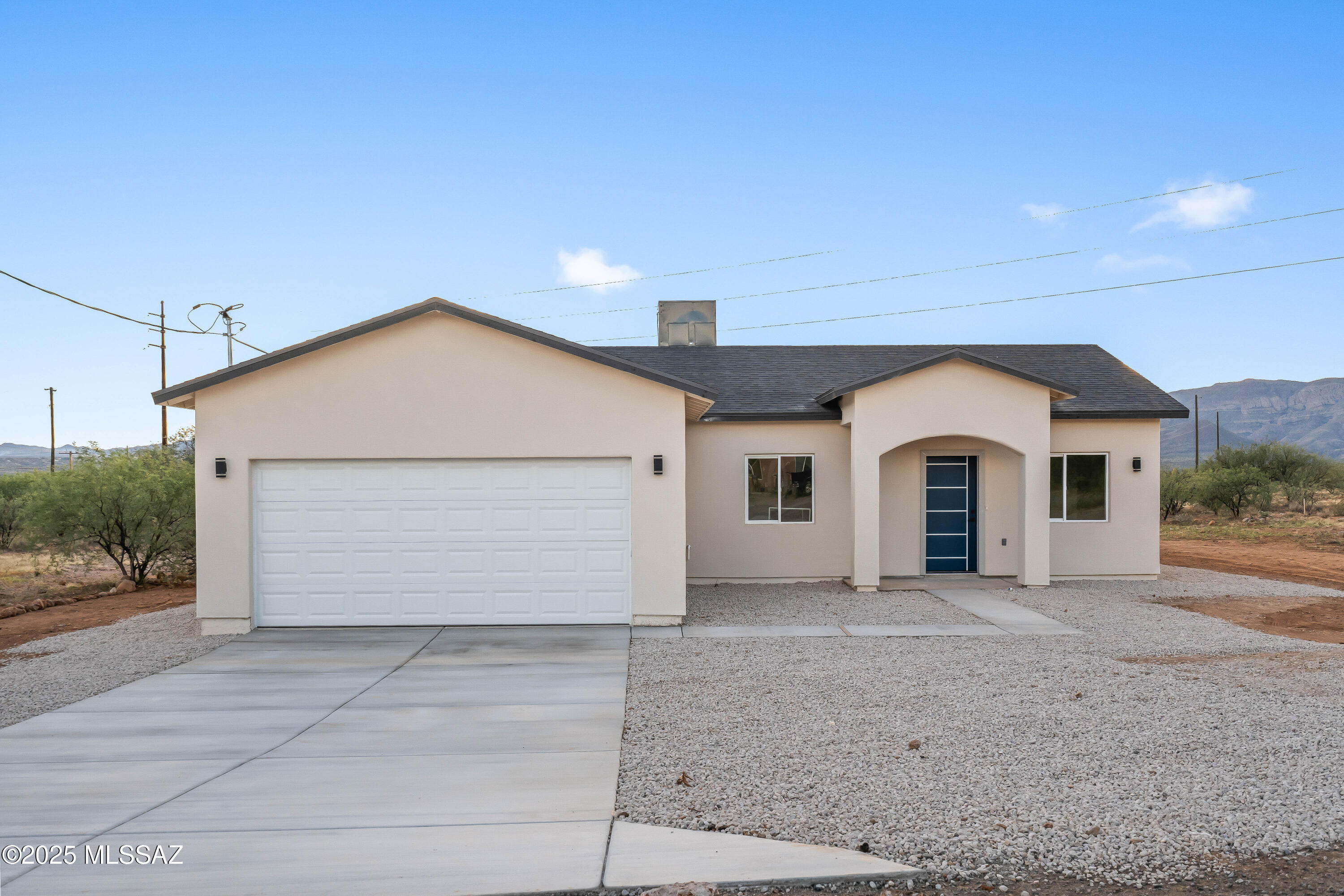 Welcome to your dream home! This stunning, newly constructed 3-bedroom, 2-bathroom residence offers an inviting open layout with vaulted ceilings that create a sense of spaciousness. The modern kitchen is a chef's delight, featuring granite countertops and sleek cabinetry accented with elegant gold fixtures. Enjoy breathtaking mountain views from the comfort of your living room or the serene backyard.