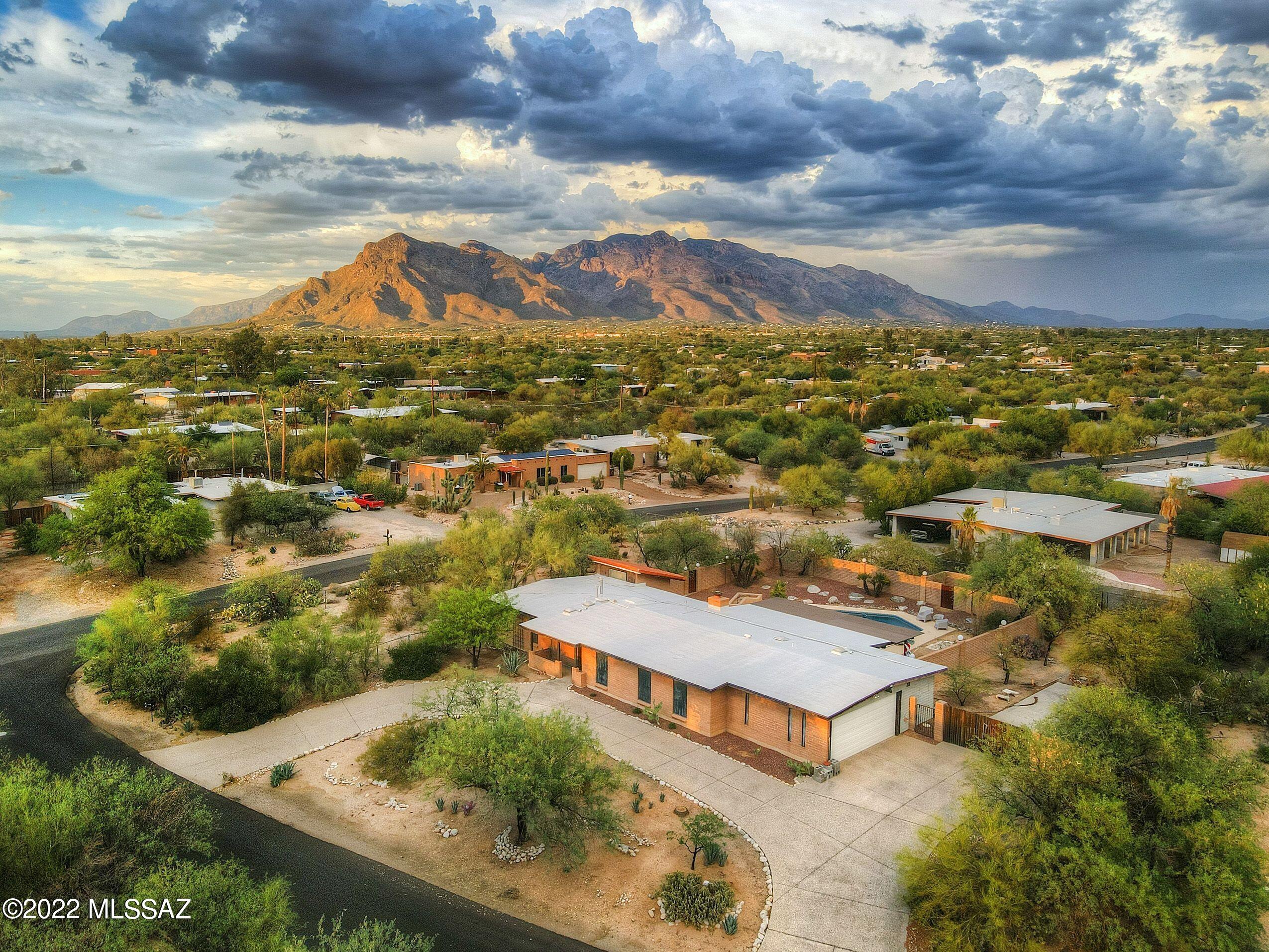 This sweet home located on a corner lot with a pool is the perfect home for someone who wants an easy fixer upper. The property is conveniently located close to schools, shopping & restaurants. It has new tile floors in the living room & the pool was updated in 2019. The pool area is secluded, but there is additional land large enough for a guest house or workshop. One of the few houses in the neighborhood with both a paved driveway and 2 car garage. Garage has a walk in storage room attached.
