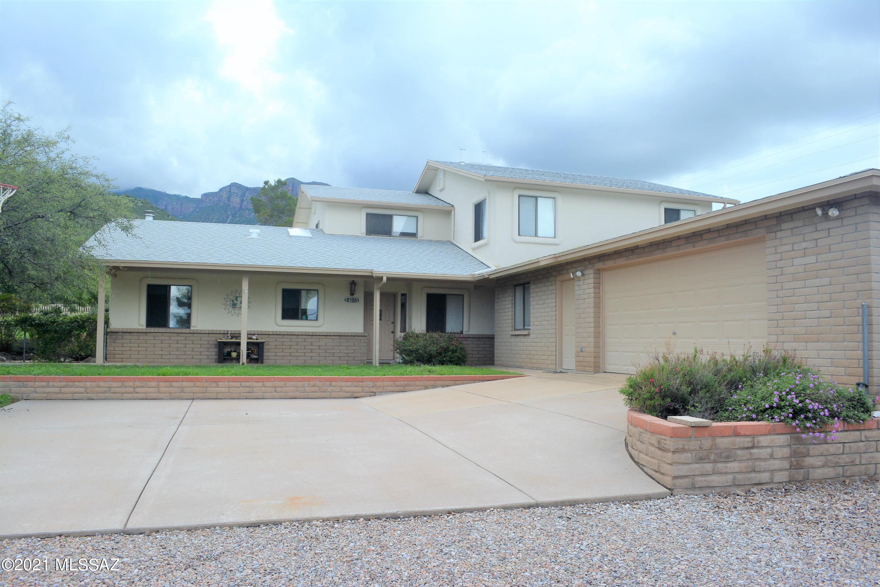 Well maintained 2 story home sits on a 1 acre lot with spectacular mountain views. Main home features 3 bedrooms, 2.5 bath with office/den. Living room with wood stove, kitchen with stainless steel appliances, and plenty of cabinetry, and tons of storage throughout. Master suite includes tub/shower and balcony to sit out taking in the views. Added 1 bedroom guest suite with kitchenette and full bath. Covered front porch and back patio with swing. Plenty of parking with a 2.5 garage/workshop, covered 2-car carport and RV parking space. Fully fenced yard with mature trees and grass. Interior photos to follow soon as sellers are packing and moving out of the home. Be the first to schedule your showing today!