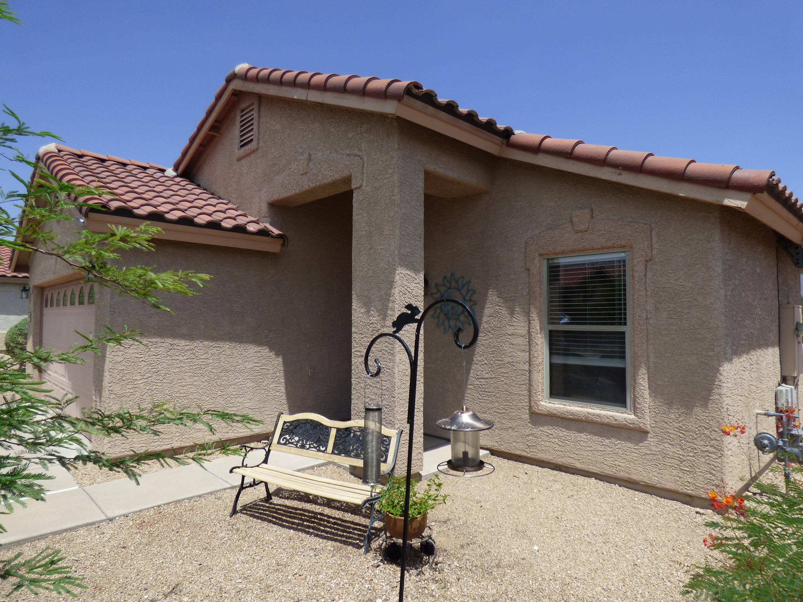 This great 1762 square foot, 3 bedroom, 2 bath home is truly move in ready. The current owners have done some smart improvements since they moved in and it shows their pride of ownership. High quality ''off the wall'' bed in one bedroom, Premium man made turf in the back yard, new 50 gallon water heater, excellent high storage in the garage. Tucson's West side Rancho Agua Dulce community has a gated entry, a nice community pool and spa, plus some of the best choices for common area plantings in Tucson. Come take a look at this gem of a house.