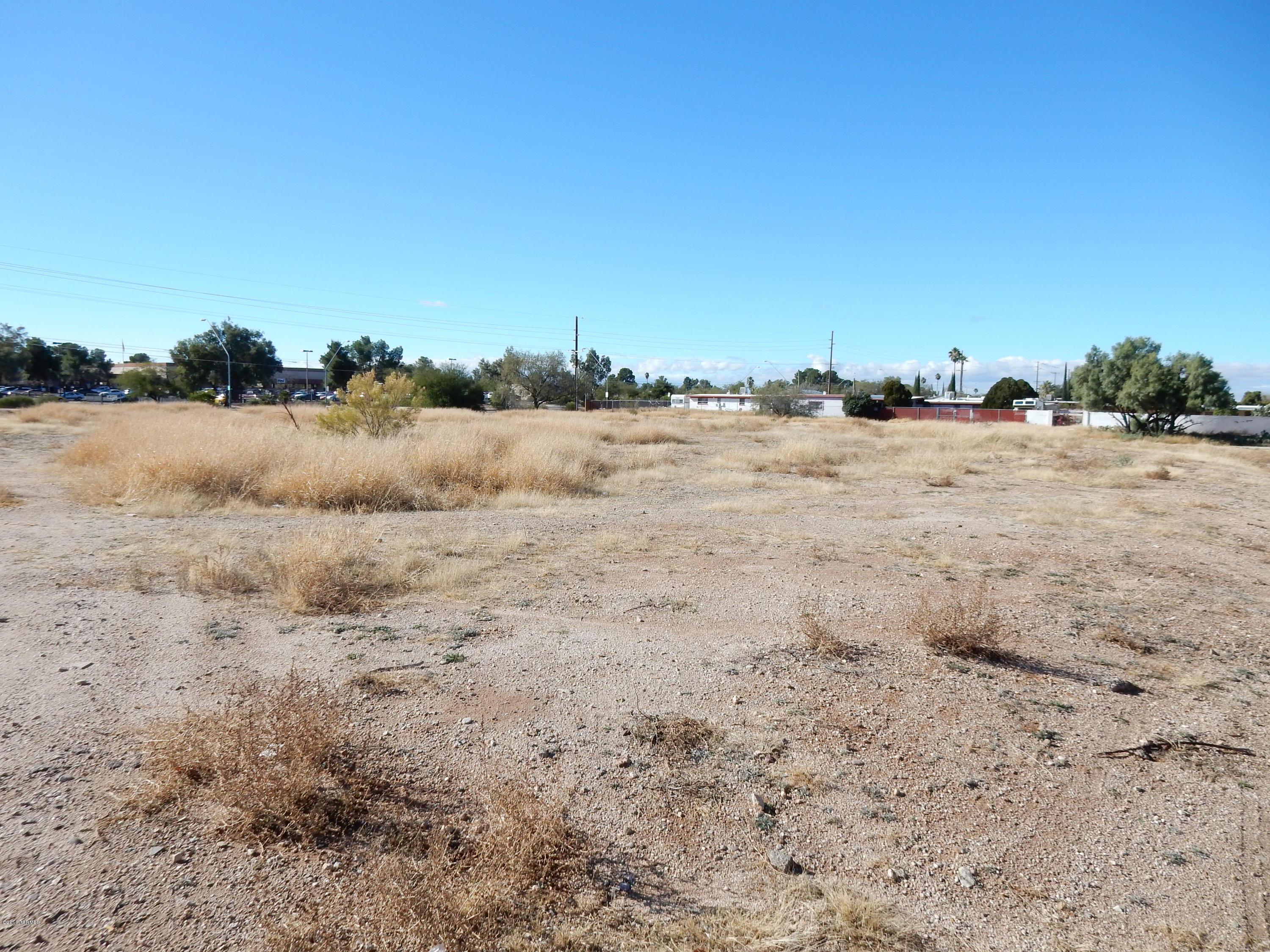 larger and very flat, easily built on. North west corner of Pantano/Escalante. Caddy corner from Santa Rita High School, with mountain views. Property border Carson Park subdivision. Address has not been assigned yet, 7801 E Escalante is approx and only used for marketing purposes. Buyer to verify location of utilities.
