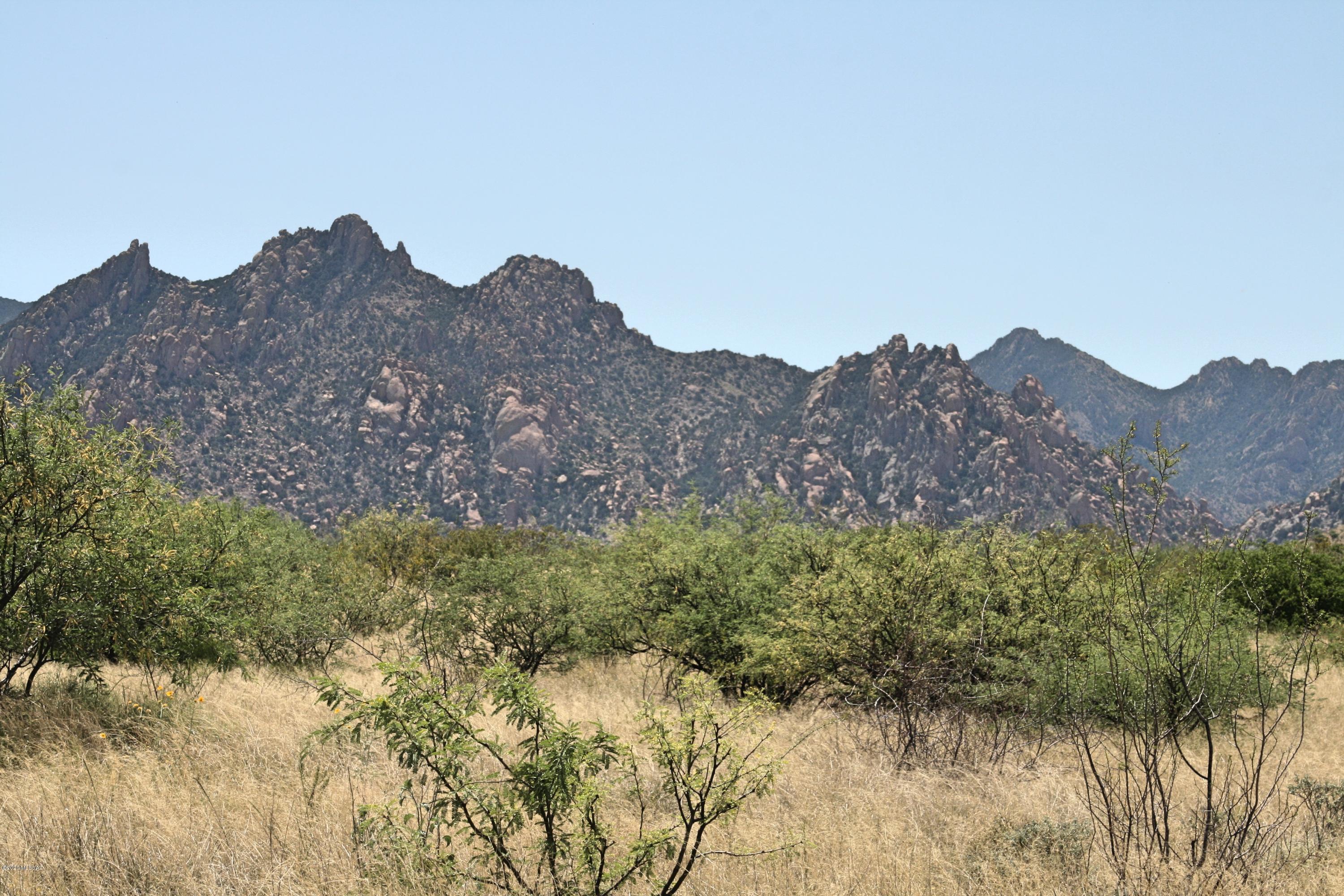 This is one of the few lots South on Diamondback Road where the ground is very suitable for building a home and to have horses. Additionally, this site has super views of the Cochise Stronghold with Treaty Hill in the mix. Only a short 20 minute drive into Benson from this location and more like 20 minutes on horseback to the entry of the Stronghold. Rural lifestyle, easy access to Benson, and a great place to ride a horse all on 36 acres of your land. Social Distancing at it's best.