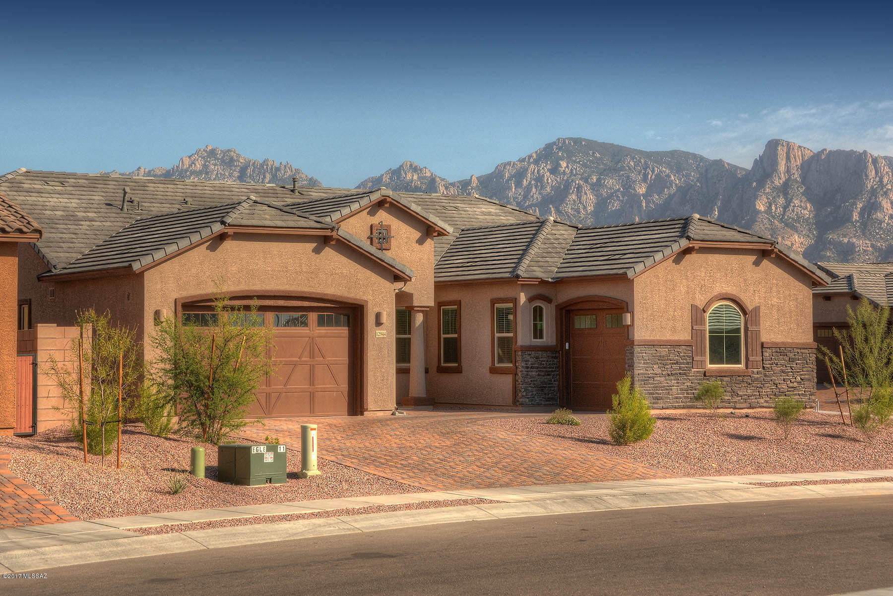 This 2017 Lennar build is truly exceptional in quality and finishes! Located in the heart of Oro Valley and close to amenities, yet tucked away in a quiet tranquil community on a .24 acre corner lot. This home boasts 5 Bedrooms/3 Bathrooms, 3061 sq ft, gourmet kitchen w/ granite countertops, SS appliances including double ovens & gas range cooktop, generous island with bar seating and pendant lighting. Kitchen flows into the central great room w/ cozy gas fireplace and formal dining room with coiffured ceiling and custom chandelier. The expansive Master Bedroom w/ spa-like bath truly encompasses an owner’s retreat w/ oversized custom tile shower, soaking tub, executive height double sink vanity, quartz countertops, & sizable walk-in closet. There are four spacious guest bedrooms along w/ 2 full guest bathrooms w/ executive height quartz countertops, & tile surround showers/tub. Enjoy the outdoor living from the expansive covered patio, landscaped backyard, & stunning Catalina Mountain views! Neighborhood features path access to Hohokam Park w/ basketball courts, Tennis, Enclosed Dog Park, & Playground  to mention a few.